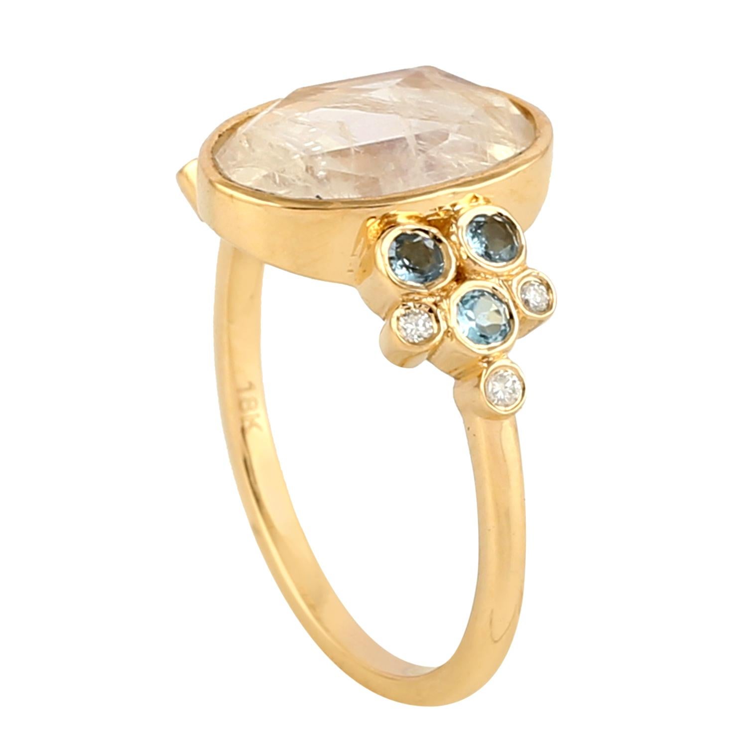 This ring has been meticulously crafted from 14-karat yellow gold. It is set in 1.94 carats of moonstone, .21 carats aquamarine and .06 carats of sparkling diamonds. Also available in ruby.

The ring is a size 7 and may be resized to larger or