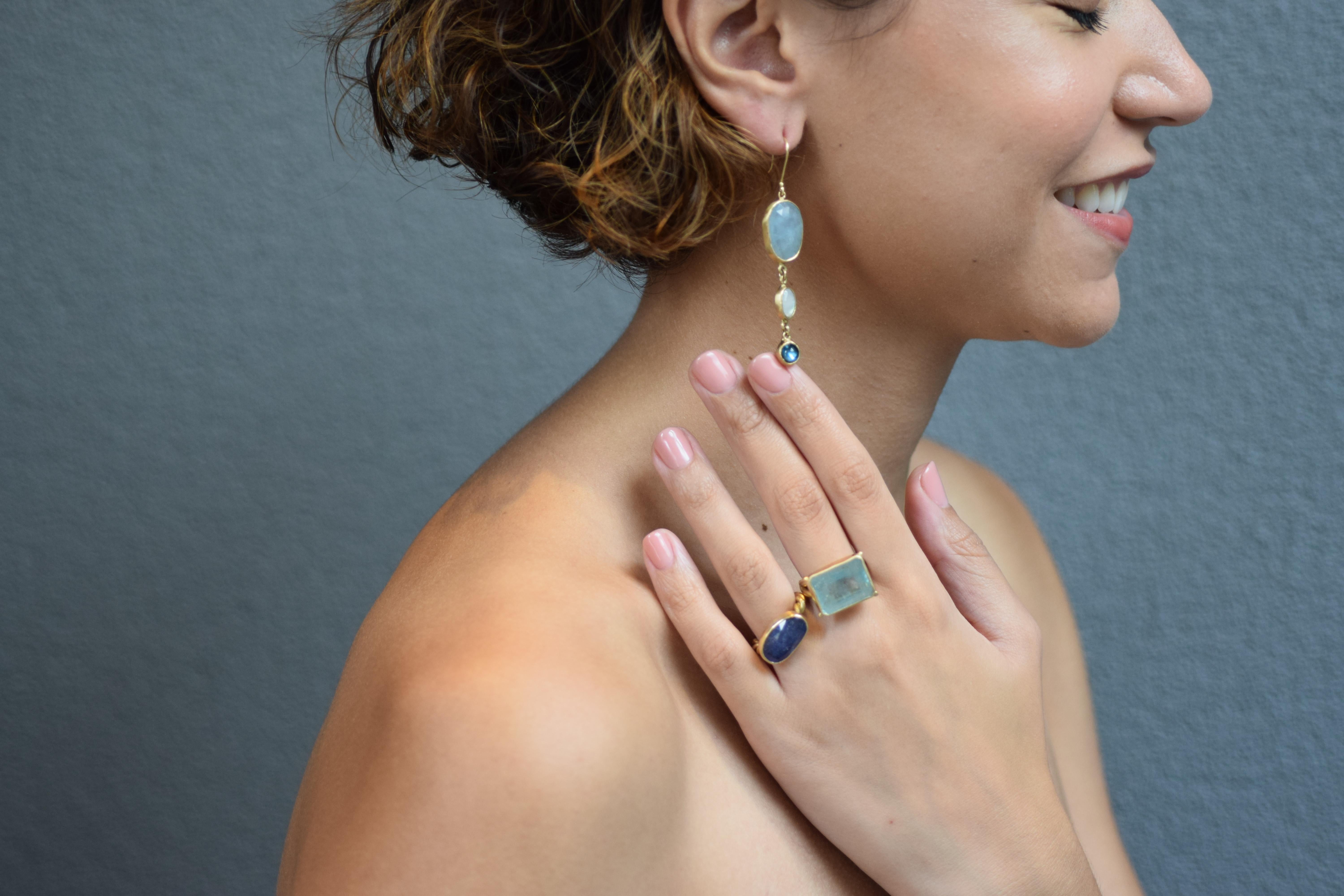 These earrings feature three tiers of gemstones -- 11.84 carats of Aquamarine rosecut slices, that have a soft blue color cut with facets to catch the light; the moonstone is Rainbow moonstone which has it's own iridescence in blues and grey and