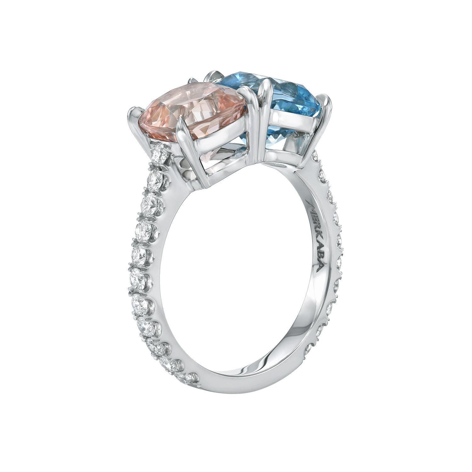 Supreme mismatched pair of Aquamarine and Morganite cushions, weighing a total of 4.02 carats, are decorated with a total of 0.55 carats of round brilliant collection diamonds, mounted in this exclusive platinum ring.
Size 6. Re-sizing is