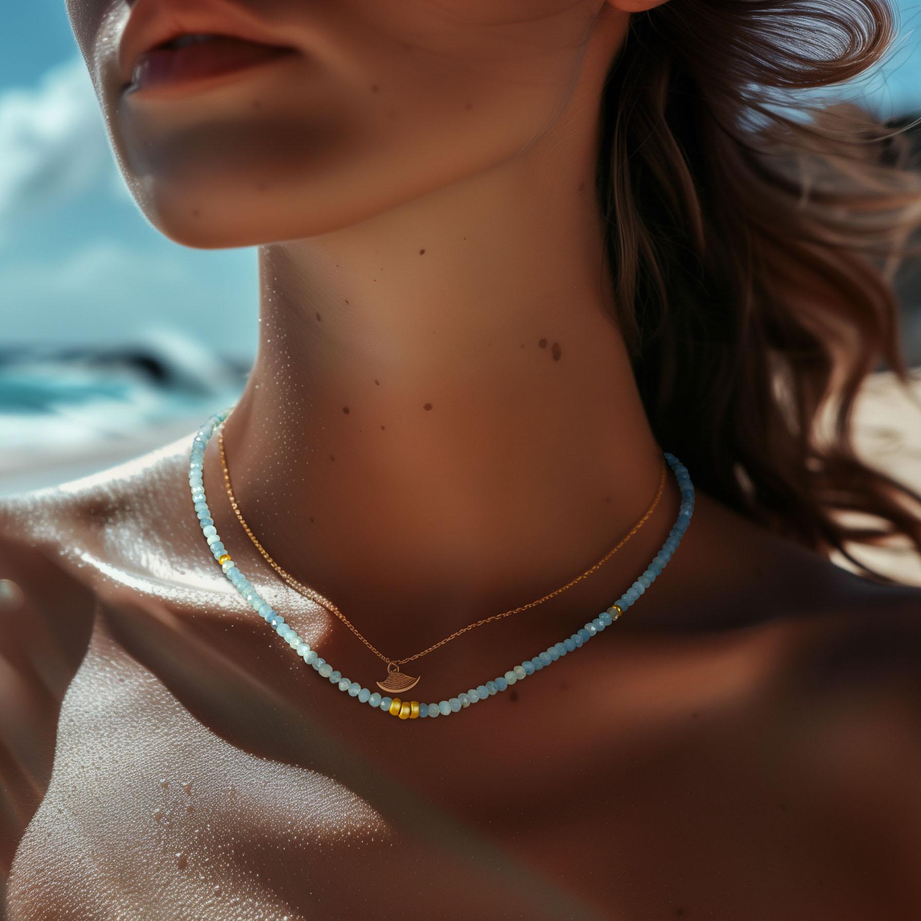 This aquamarine and 14K gold necklace from Bombyx House exudes serene elegance. The delicate gemstone strand creates a calming, sophisticated look.

	•	16