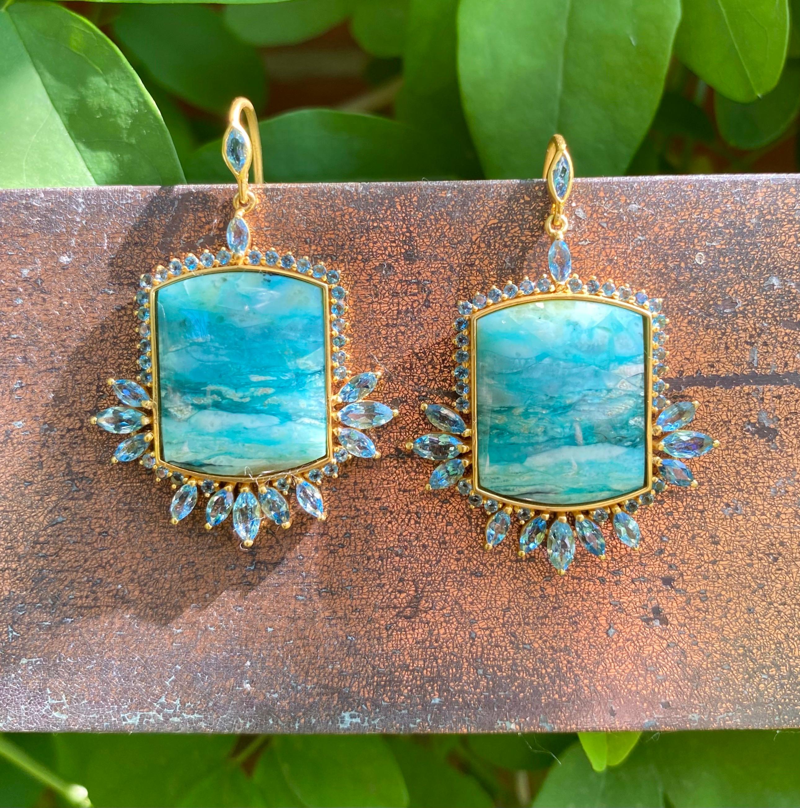Designed by award winning jewelry designer, Lauren Harper, these fossilized opalized wood and aquamarine earrings are a one of a kind. Set in a warm 18kt Gold alloy, these hand made earrings embody ocean blues and are sure to get you noticed.