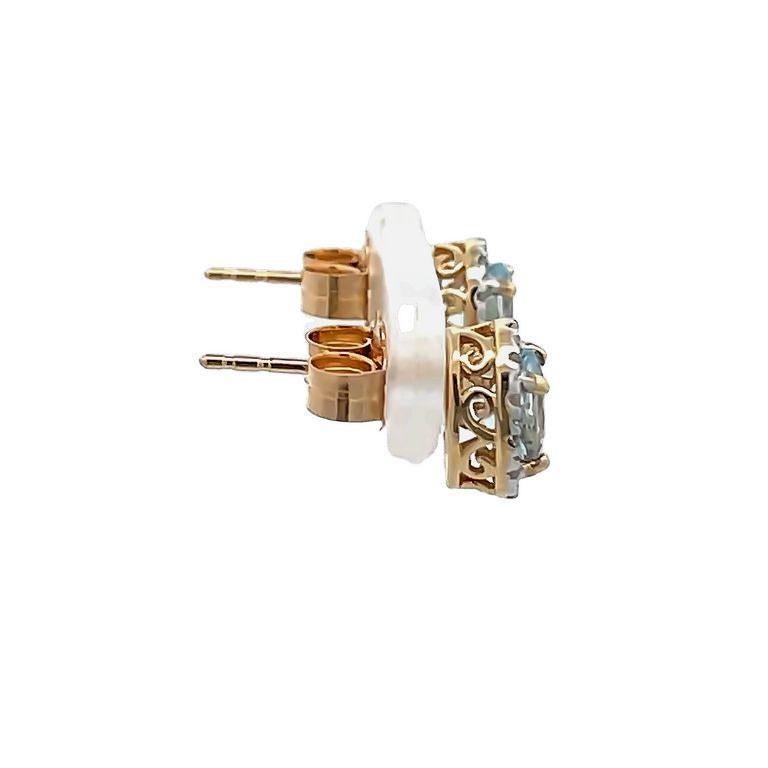 Contemporary Aquamarine Oval 0.60ct & Round Diamonds 0.10ct Stud Earrings in 14k Yellow Gold  For Sale
