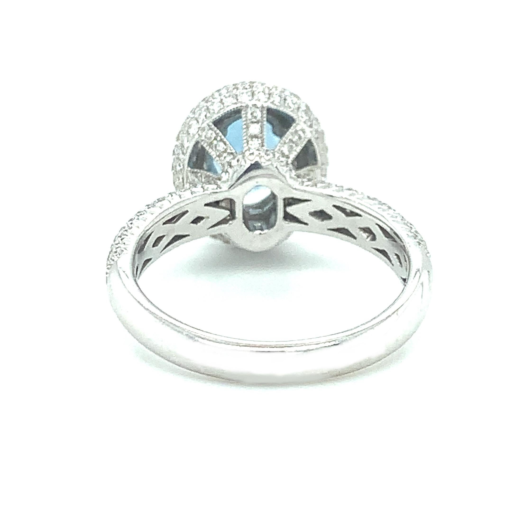 Oval Cut Aquamarine and Diamond Double Halo Engagement Ring in 18k White Gold