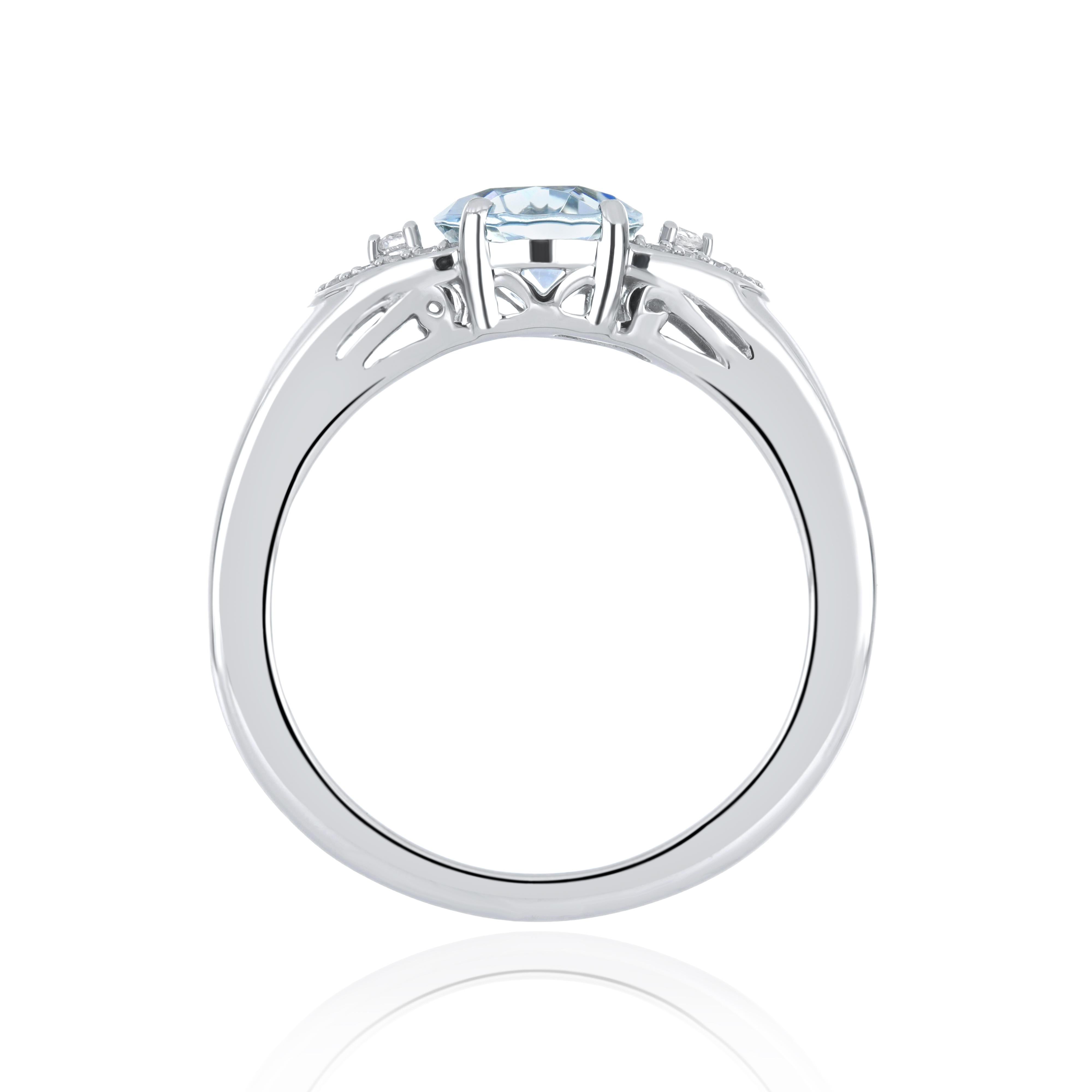 Elegant and exquisitely detailed 14 Karat White Gold Ring, center set with Aquamarine Oval 1.57Cts. White Zircon Ring Brilliant Round 0.20Cts  Beautifully Hand crafted in 14 Karat White Gold.

Stone Detail:
Aquamarine Oval : 9X7 MM
Stone