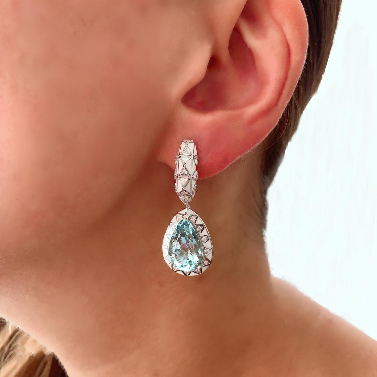 A Pair of Pear-Cut Aquamarines, Diamond and Enamel Gold Earrings in the Candy Collection by Jewelry Designer, Sarah Ho.

Aquamarine pear cut drops with total 15.28ct surrounded by white enamel and round white diamonds F VS 0.25ct as a detachable