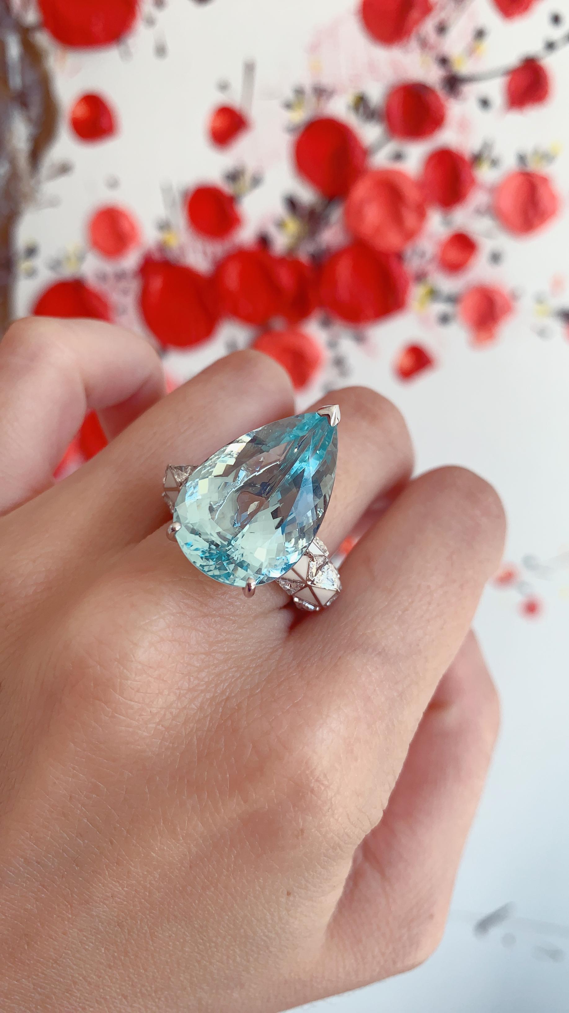 A Pear-Cut Aquamarine, Diamond and Enamel Gold Ring in the Candy Collection by Jewelry Designer, Sarah Ho.

This 16.3ct pear cut Aquamarine coolly sits among 1.3ct trillion diamonds and ice white enamel in 18kt white gold. 	

The Ring is an English