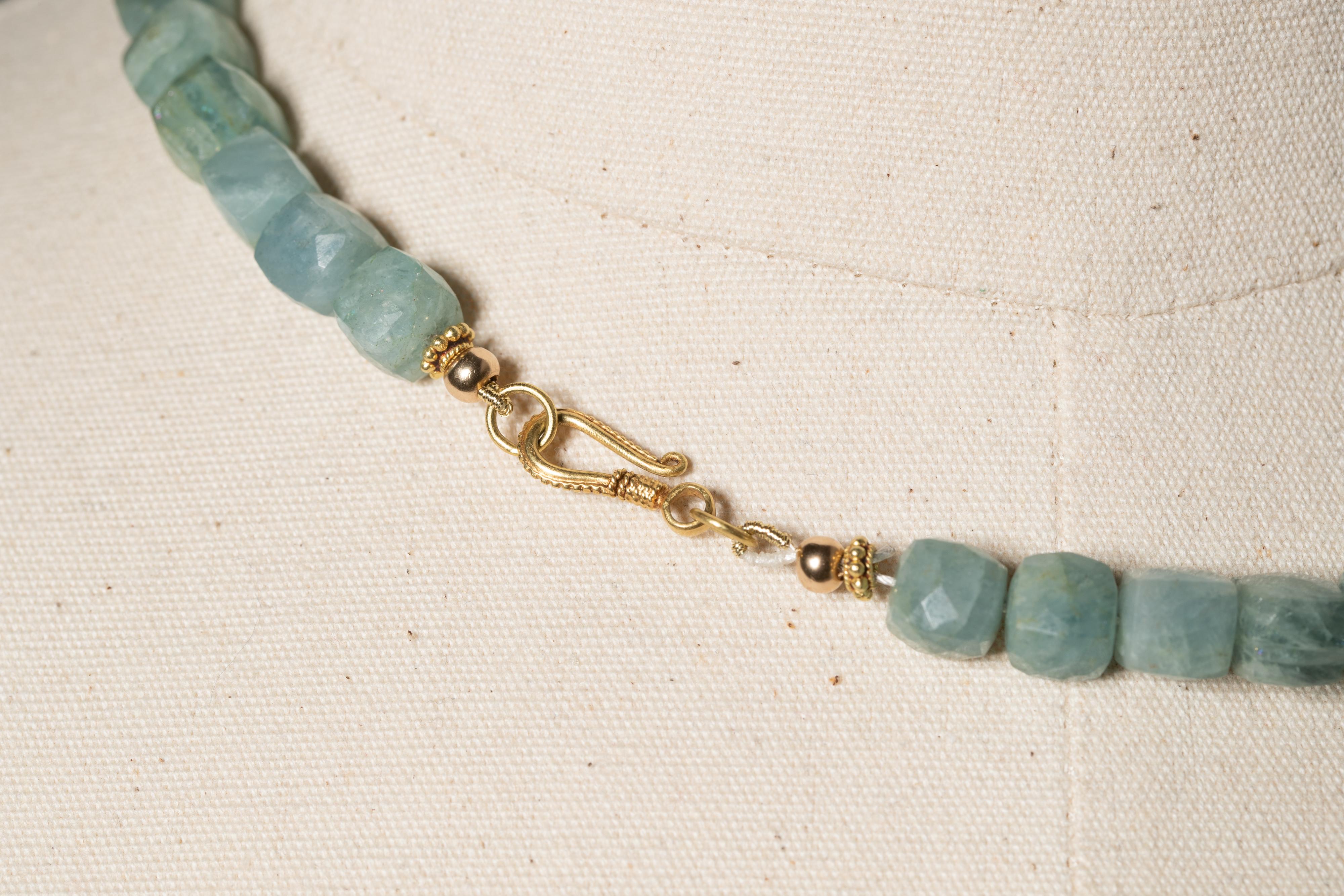 Unusual faceted, square aquamarine beads with a baroque pearl center and fresh water pearls interspersed with 22K gold.  22K gold hook clasp.  By Deborah Lockhart Phillips