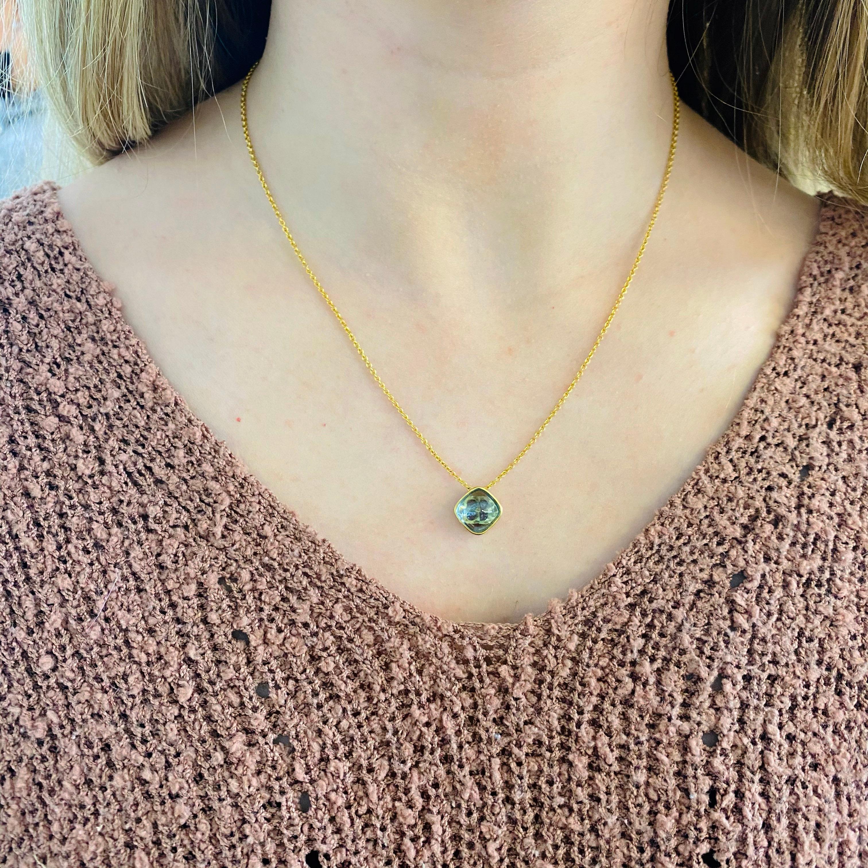 This custom made genuine natural aquamarine pendant is a one-of-a-kind!  The beautiful bullet bombe cabachon aquamarine pendant is so unique and beautiful.  if you want your eyes to pop the color of this gemstone aquamarine looks fabulous with blue,