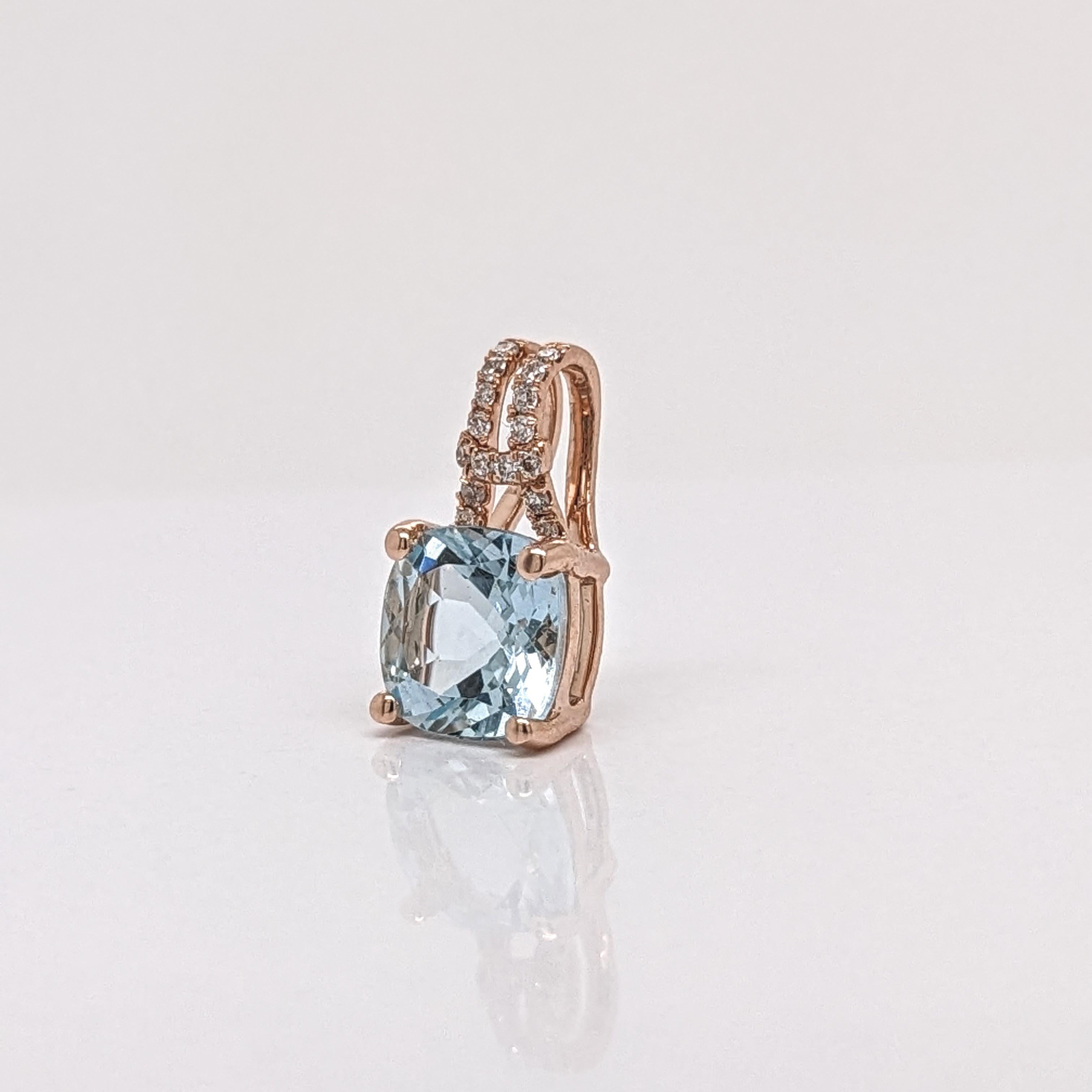 This adorable pendant showcases a 5x3mm cushion cut aquamarine set in a diamond accented pendant in solid 14k rose gold. A lovely design for your daily wear! This pendant also makes a beautiful March birthstone pendant for your loved