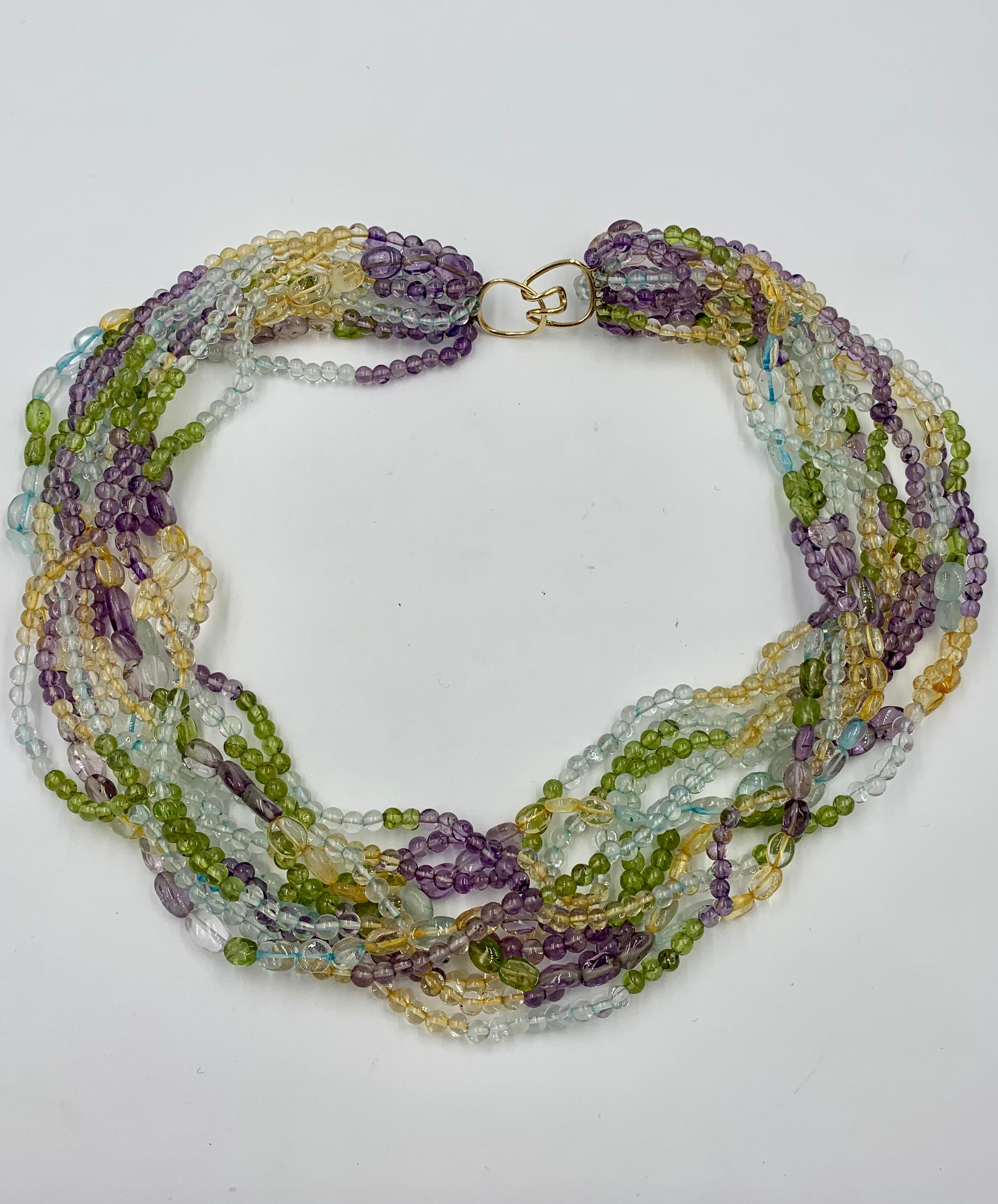 Contemporary Aquamarine Peridot Citrine Amethyst Torsade Necklace 14 Karat Gold 11 Strand For Sale