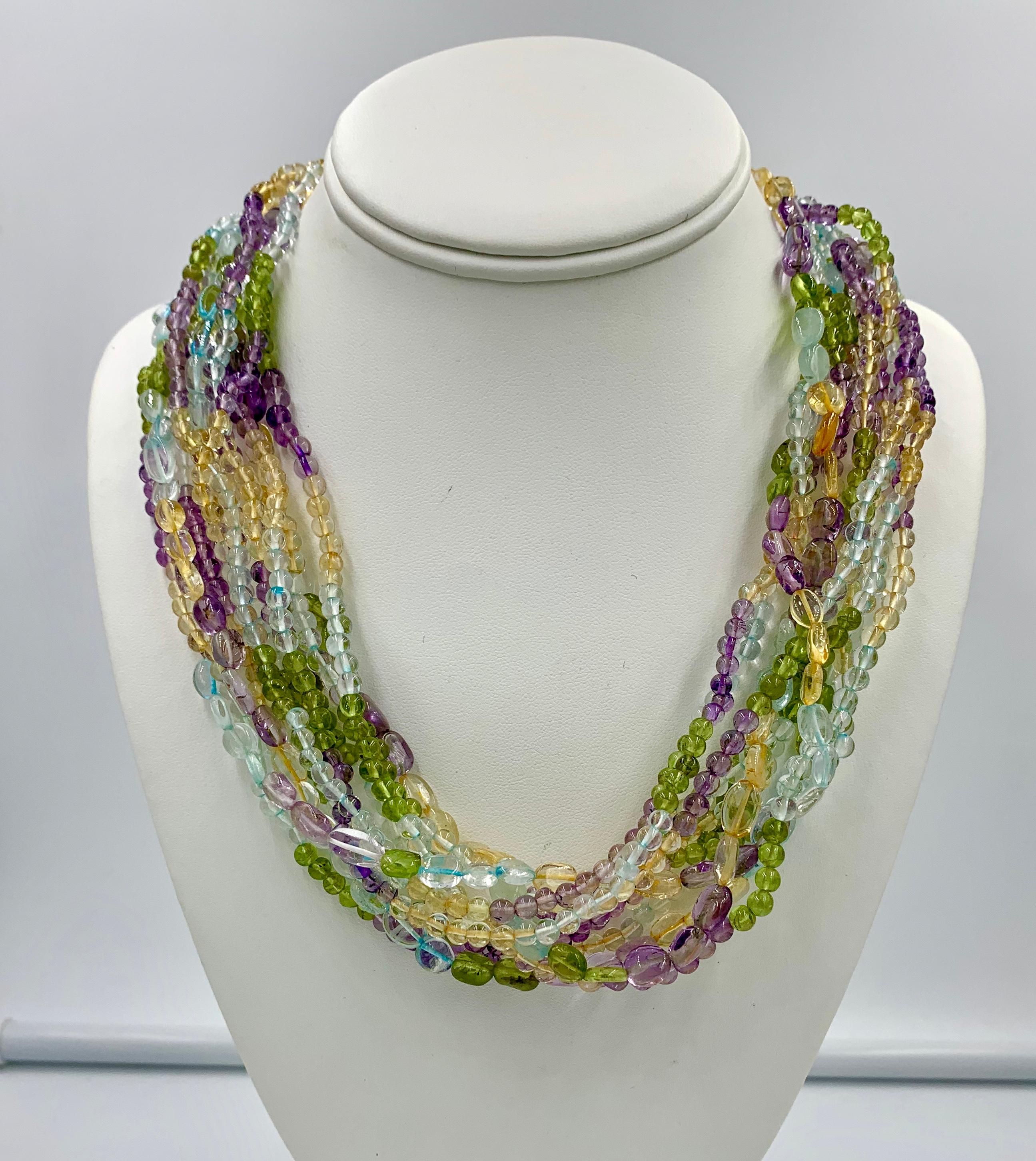 Mixed Cut Aquamarine Peridot Citrine Amethyst Torsade Necklace 14 Karat Gold 11 Strand For Sale