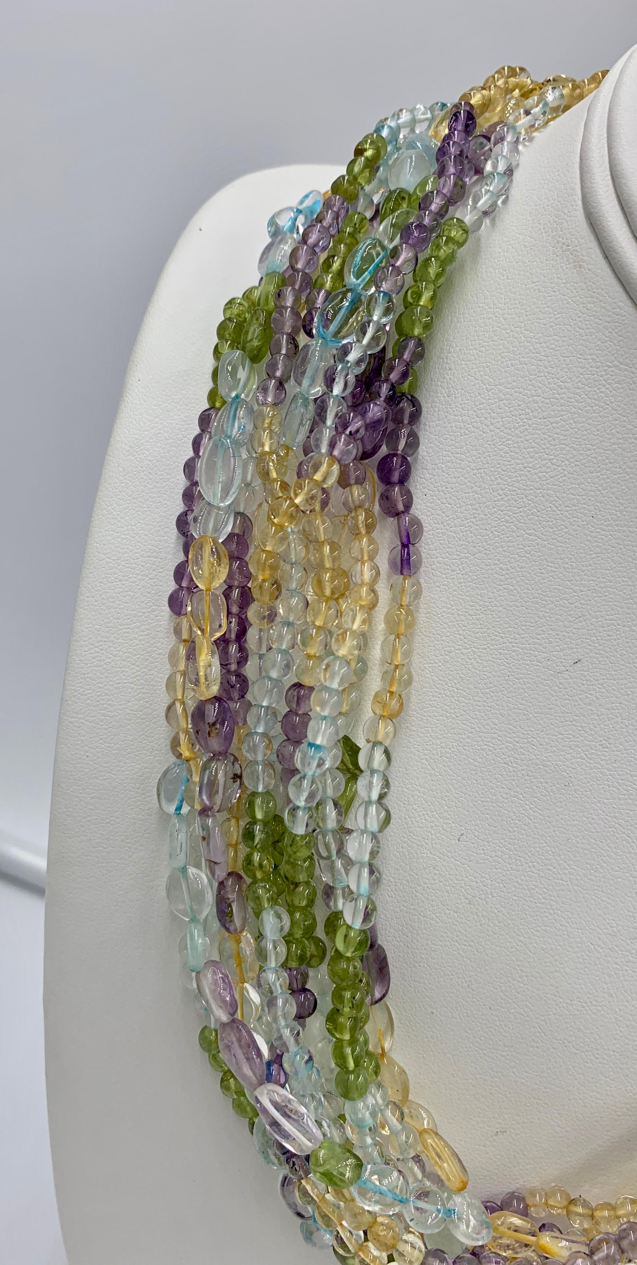 Women's Aquamarine Peridot Citrine Amethyst Torsade Necklace 14 Karat Gold 11 Strand For Sale