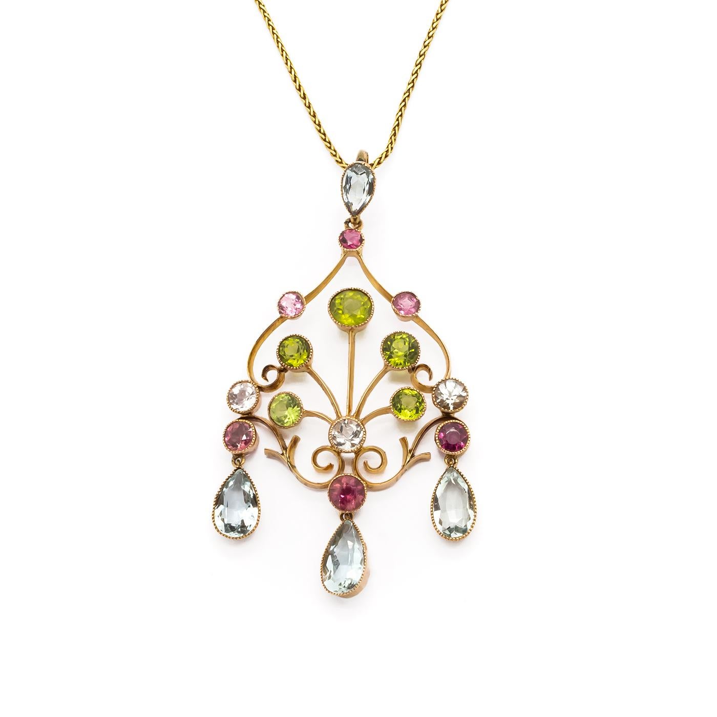 A gem-set pendant, with collet set pink tourmaline, peridot and aquamarines, suspended from a 14ct yellow gold frame, on a fine loop-in-loop link chain, measures 60 x 31mm, chain length 50cm