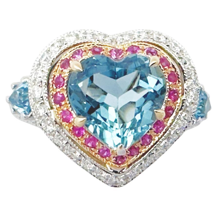 Bague en or blanc 18 carats sertie d
aigue-marine, de saphir rose et de diamants