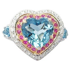 Anello con acquamarina, zaffiro rosa e diamante incastonati in oro bianco 18 carati