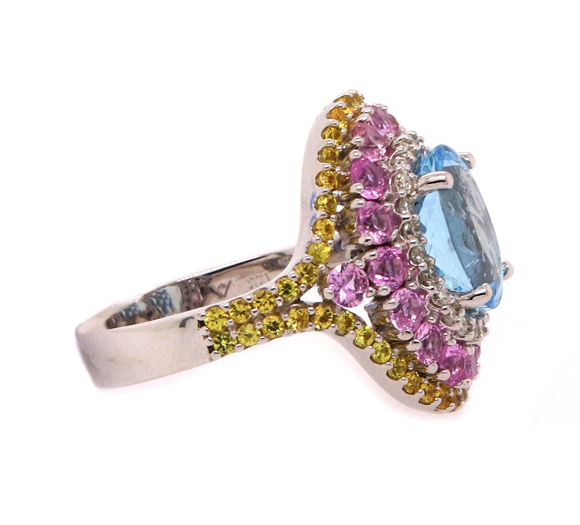 Material: 14k White Gold 
Center Stone Details: 1 Oval Aquamarine at 2.50 Carats - Measuring 10 x 8 mm
Mounting Stone Details: 18 Round Pink Sapphires at 1.41 Carats
Mounting Stone Details: 54 Round Yellow Sapphires at 0.65 Carats
Diamond Details: