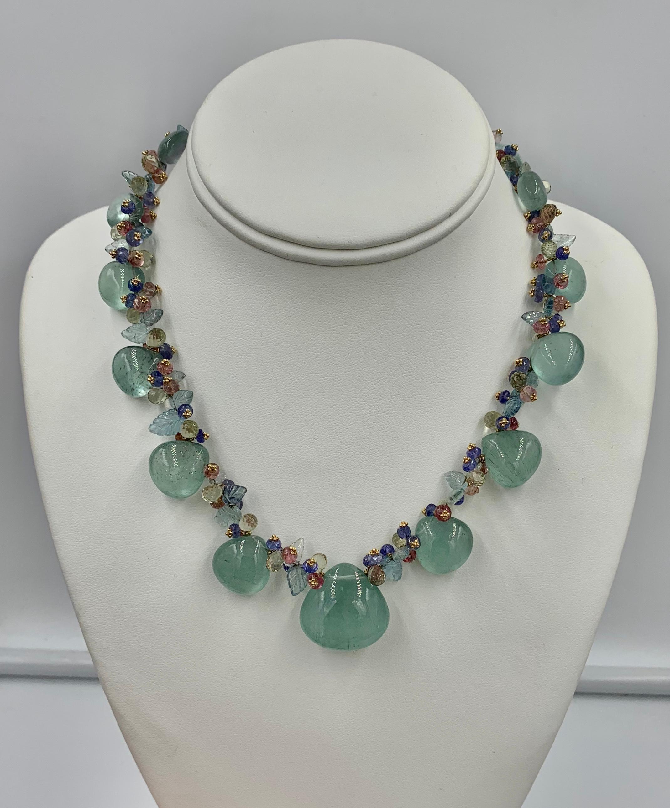 Indulge in a stunning Aquamarine, Pink Tourmaline and Tanzanite Multicolored Bead Necklace in 14 Karat Gold.  The stunning Multi Gem Necklace is set with gorgeous Aquamarine gems.   Between the large Aquas are fancy cut aquamarines, pink tourmaline