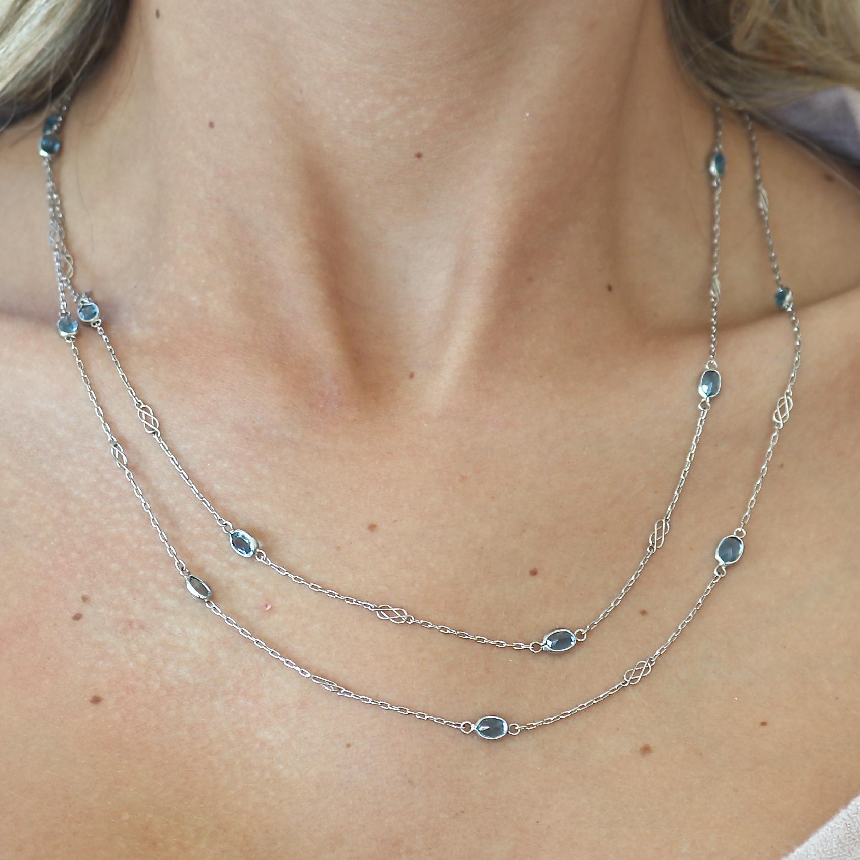 A subtle elegance that is unique and perfect in every way. Featuring numerous colorful aquamarines that are each bezel set in the delicate platinum chain. 40 inches long.