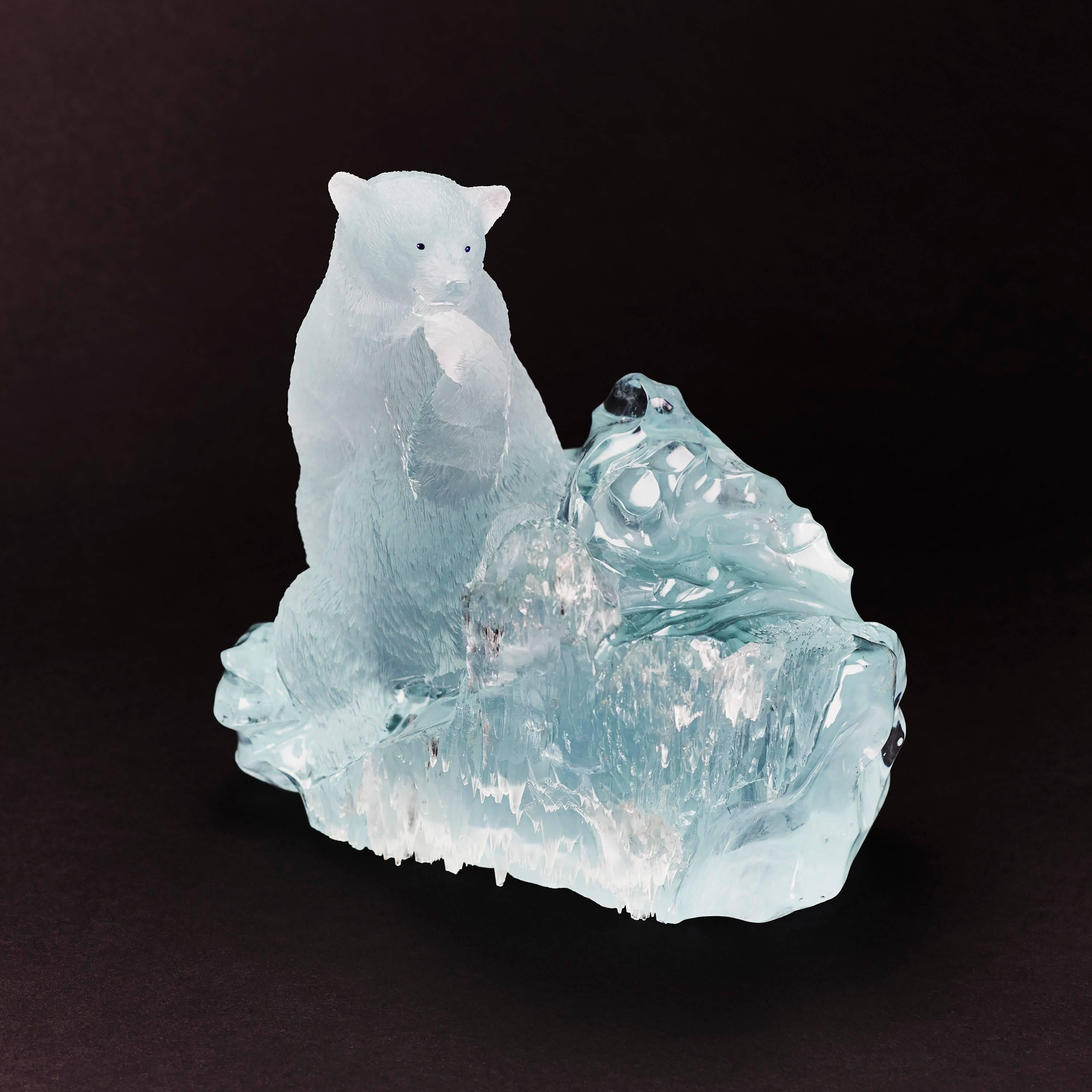 Outstanding carving of a polar bear in aquamarine.
The rough crystal has been partly untouched, showing the natural crystallization of the aquamarine
and the bear has been carved within the same crystal. Base and polar bear are not attached.
The