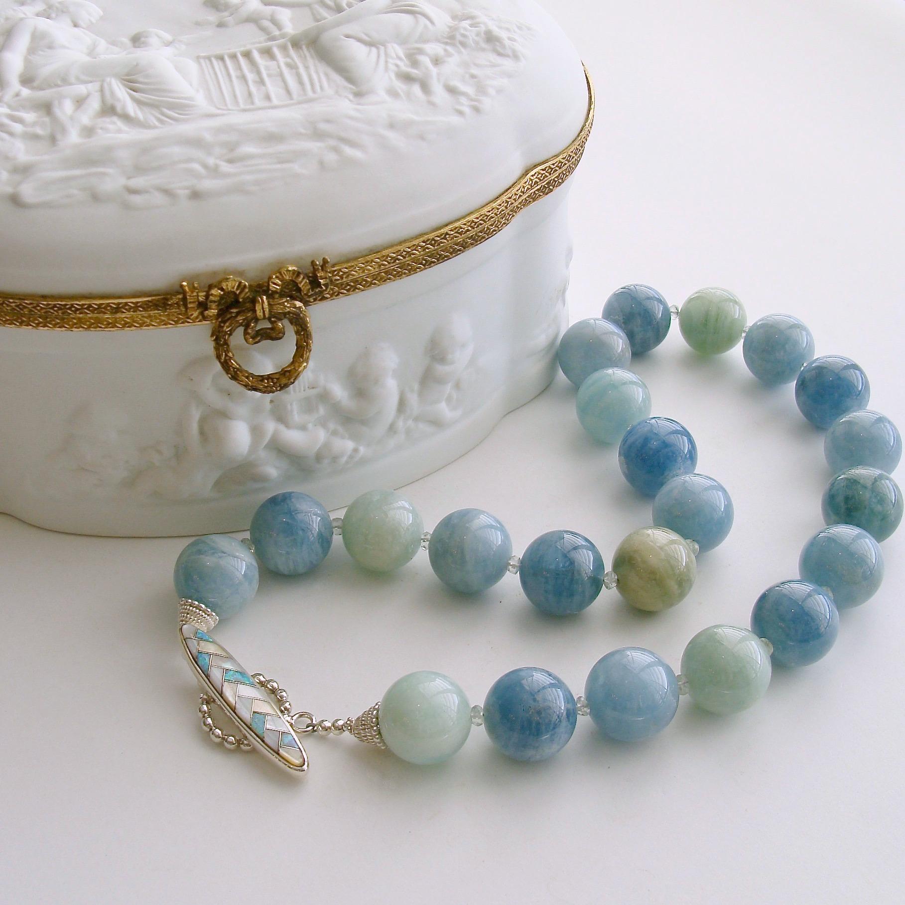 Luxe 18 mm natural organic polished aquamarine beads range in colors from watery aqua blue to fresh spring greens.  Each of the generous beads is separated with a delicate prasiolite rondelle.  The opal and mother-of-pearl inlay marquise herringbone