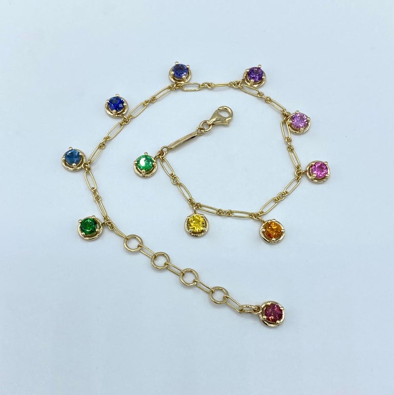 Aquamarine Rainbow Sapphire Tzavorite Gemstone Handmade Bracelet 18 Karat Gold
This bracelet is handmade in yellow gold.
I wanted to create this bracelet with ten precious stones of different colors scaled: from tsavorite to tzavorite  through other