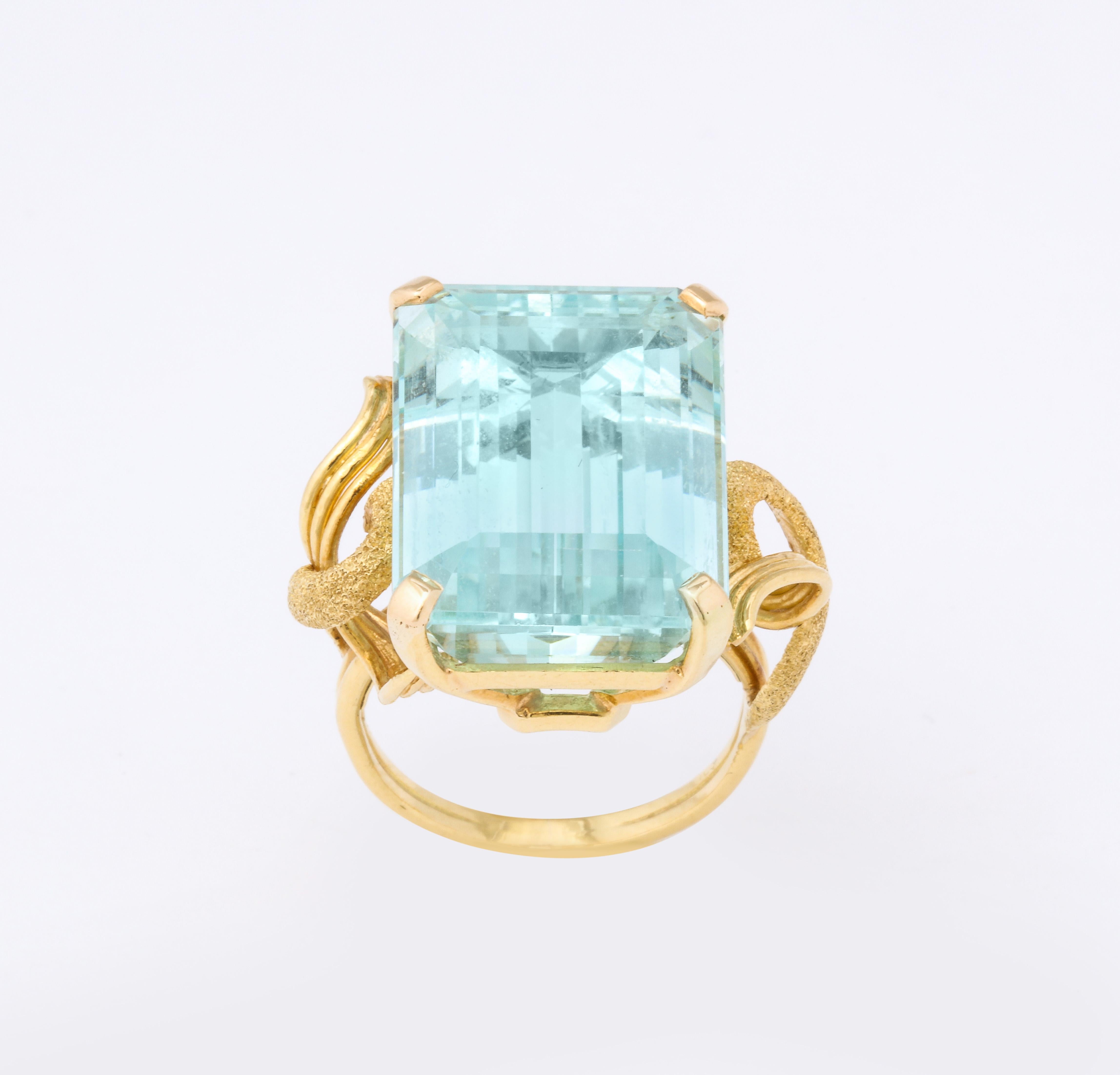 A wonderful 16 carat Aquamarine Retro Ring  set in an interesting hand  hammered 18 K mounting. There is a legible
signature  of the designer which has not been identified