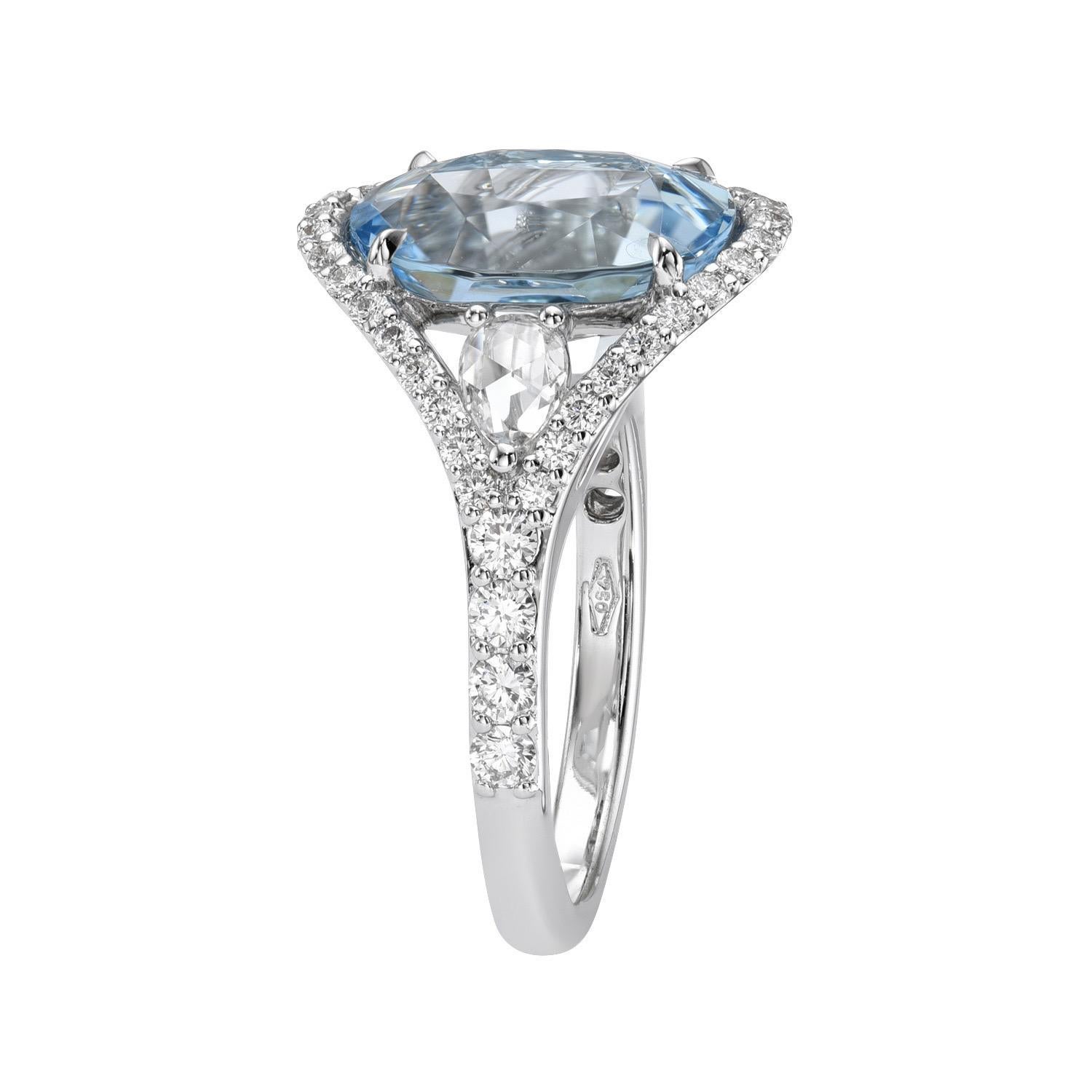 Graceful 4.26 carat Aquamarine oval, 18K white gold ring, decorated with a pair of 0.30 carat Rose Cut pear shape collection diamonds, and a total of 0.61 carat collection round brilliant diamonds.
Ring size 6.5. Resizing is complementary upon