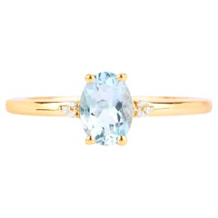 Anello con acquamarina e diamanti in oro giallo 10K
