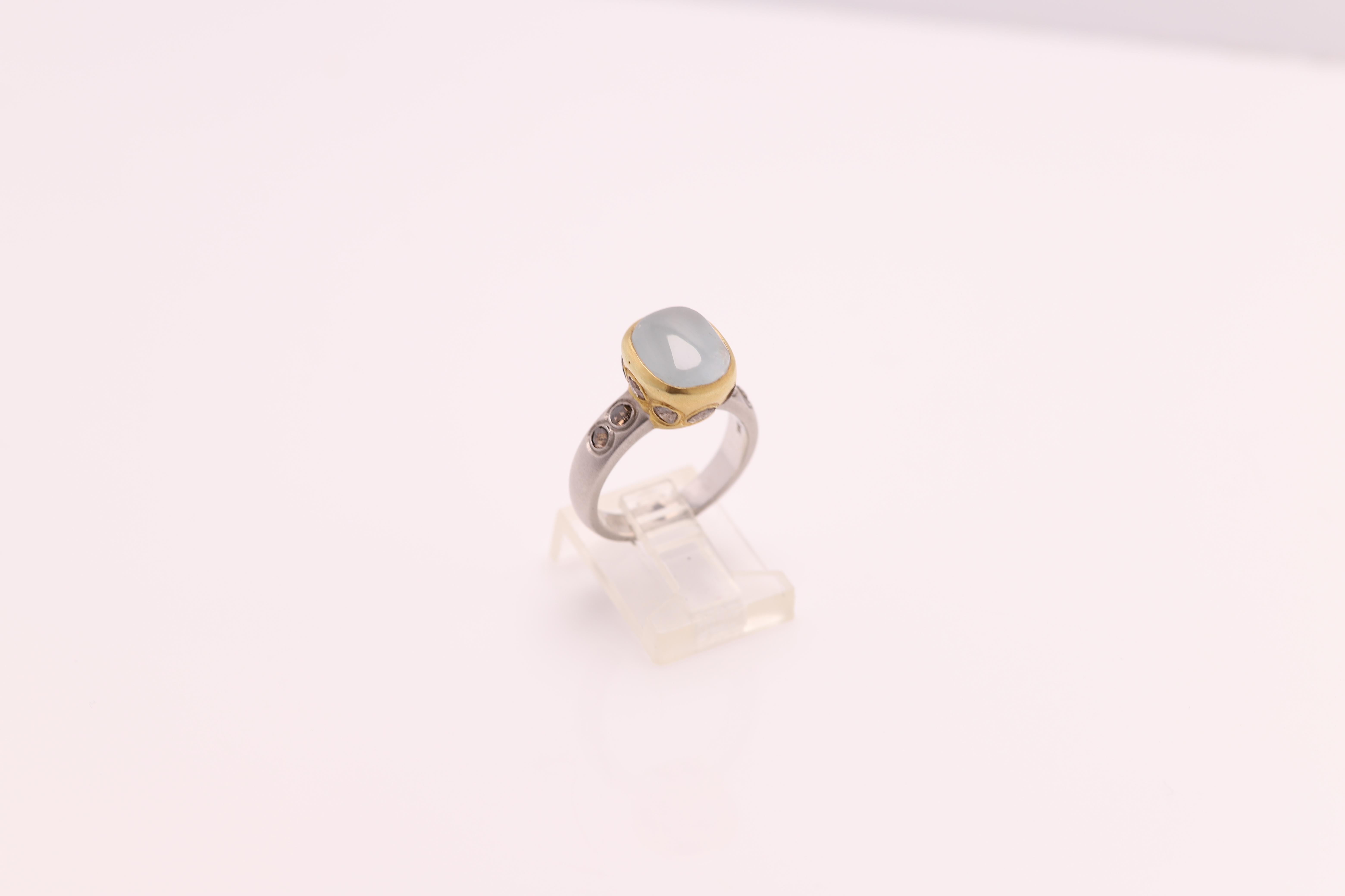 Vintage Aquamarine & Old Cut Diamonds - Hand Made in Italy.
18k Two Tone Yellow & White 7.90 grams - mat finish (not shiny gold)
Aquamarine 3.50 carat approx size 9 x 10 mm
Old cut Light Brown Diamonds 1.00 carat
Finger size 6.75
All Stones are