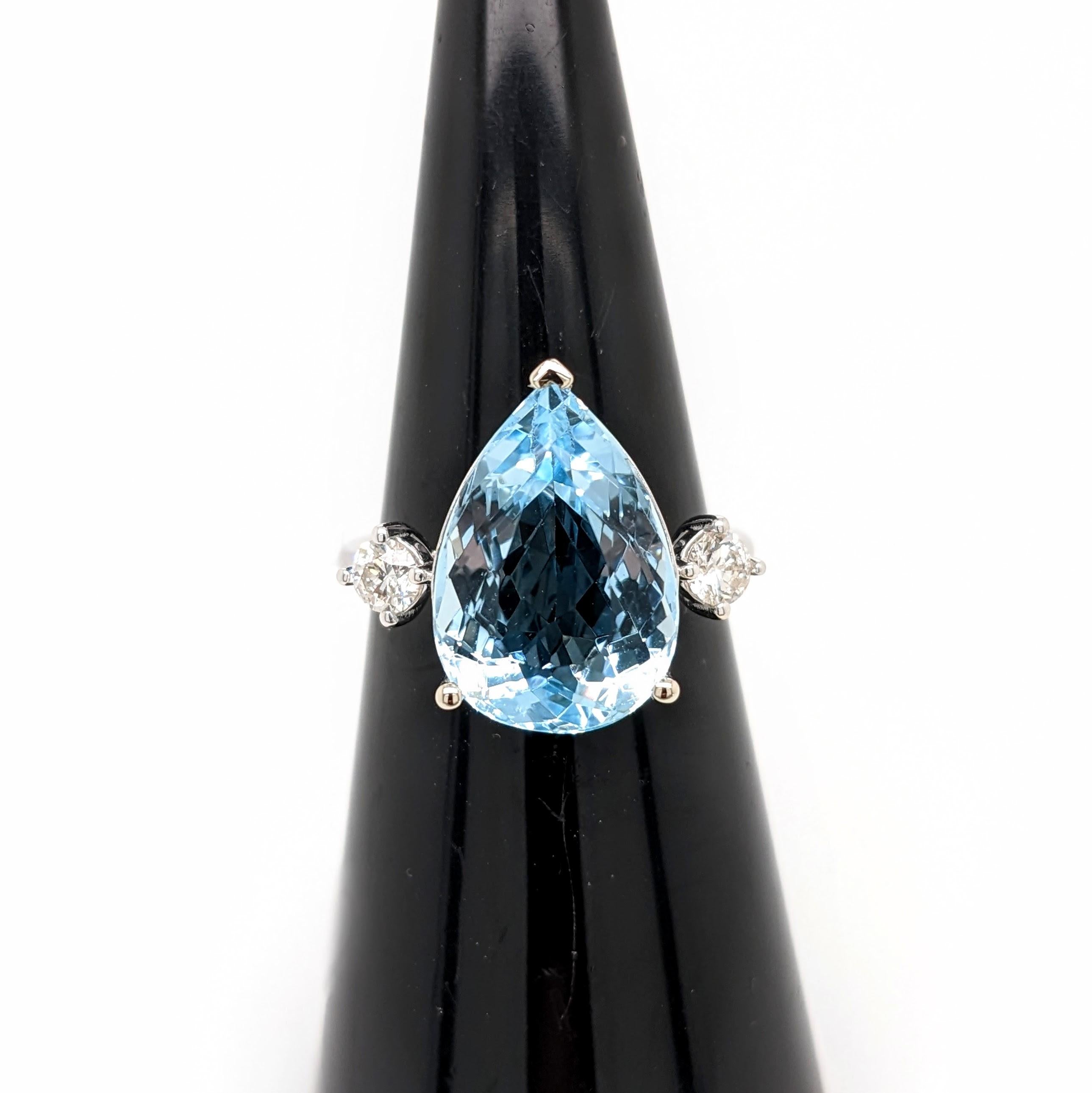 This beautiful ring features a teardrop sparkling Aquamarine in 14k white gold with natural diamond accents. A statement ring design perfect for an eye catching engagement or anniversary. This ring also makes a beautiful birthstone ring for your