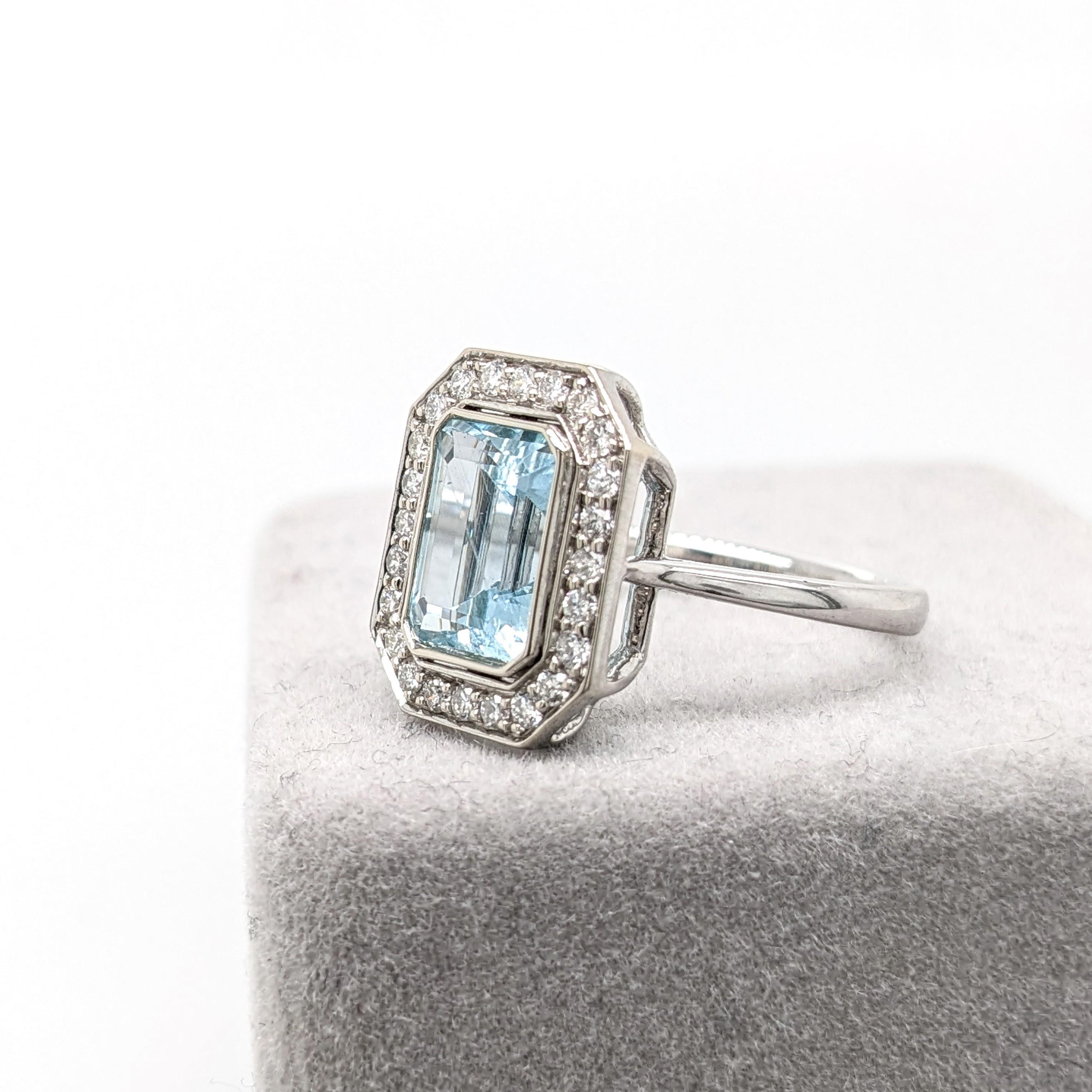 This 14K gold ring setting features a beautiful earth mined Aquamarine with a halo of natural round diamond accents. This statement ring design is perfect for an eye catching engagement or anniversary. This ring also makes a beautiful birthstone