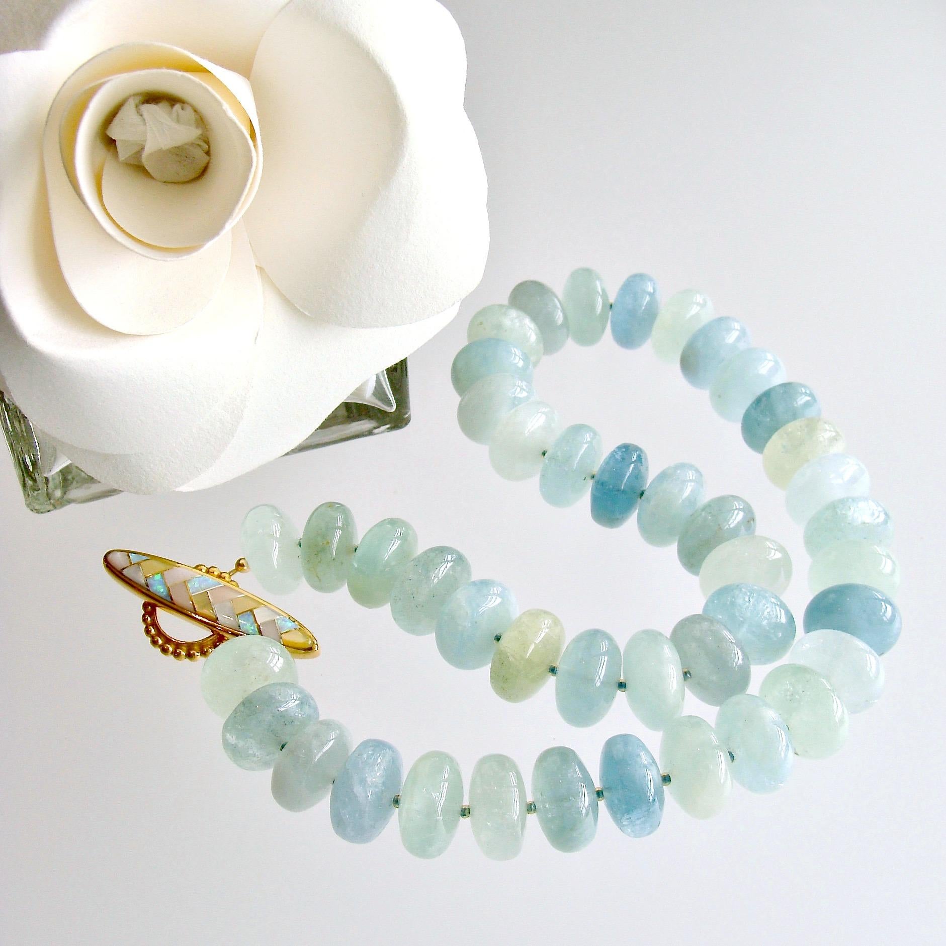 Luxe 16 mm natural organic polished aquamarine rondelle beads range in colors from watery aqua blue to fresh spring greens.  The opal and mother-of-pearl inlay marquise herringbone toggle clasp, creates a gorgeous accent when worn off center or as a
