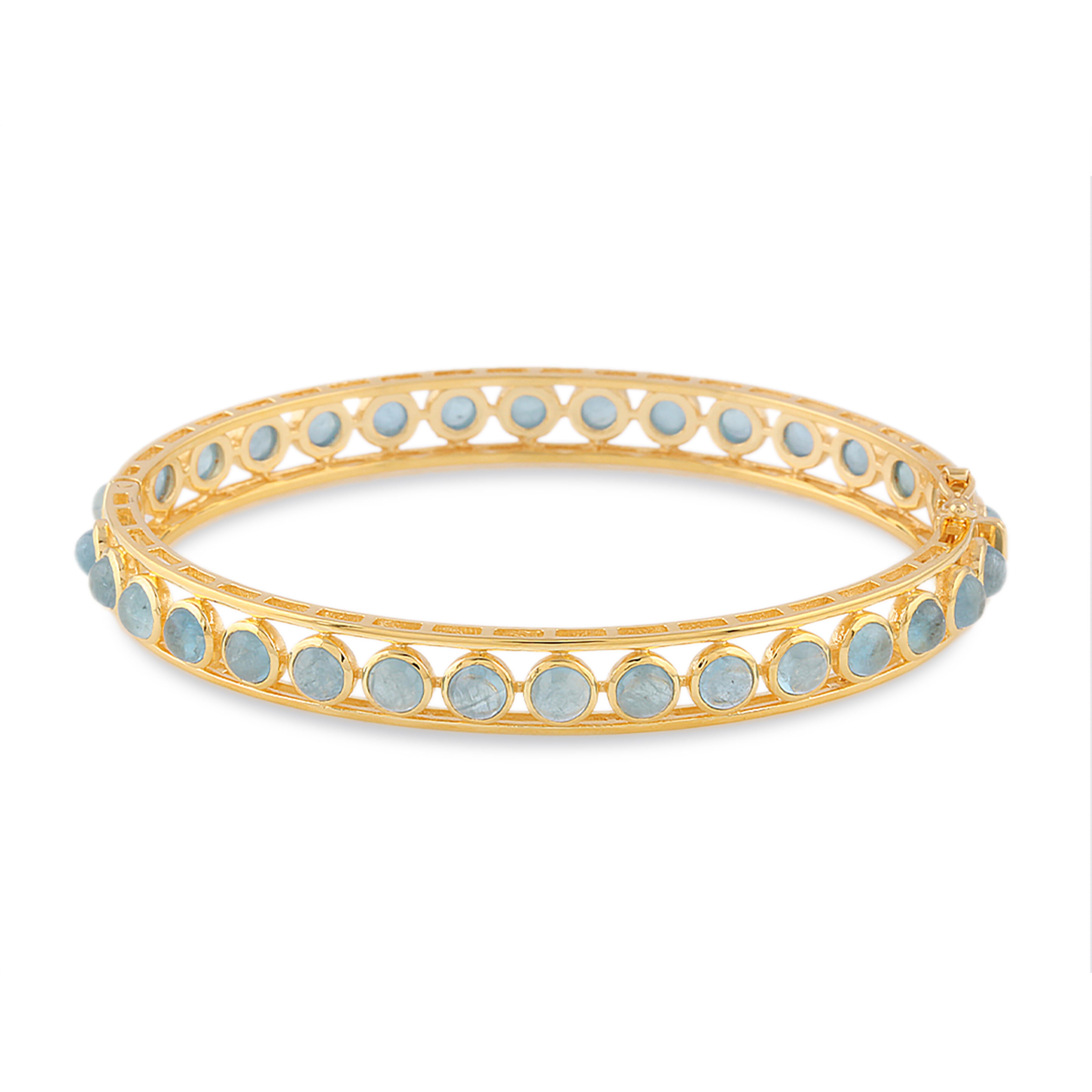 Tresor Aquamarine Bangle features 7.00 cts Aquamarine in 18k yellow gold. The Bracelet are an ode to the luxurious yet classic beauty with sparkly diamonds. Their contemporary and modern design makes them versatile in their use. The Bracelet are