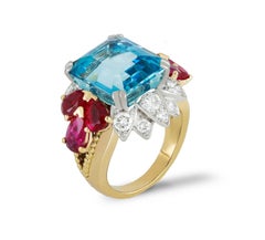 Aquamarine, ruby and diamond cocktail ring, circa 1950.