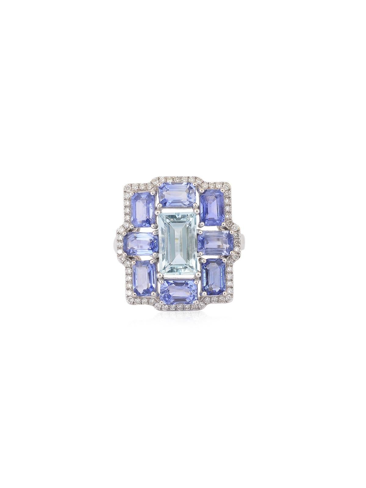 A beautiful cocktail ring with a fine Rectangular Aquamarine in the centre weighing 2.10 carats surrounded by Emerald cut Blue sapphires. 
The combination of the 2 colors makes the ring unique and eye catching at the same time.
A very versatile and