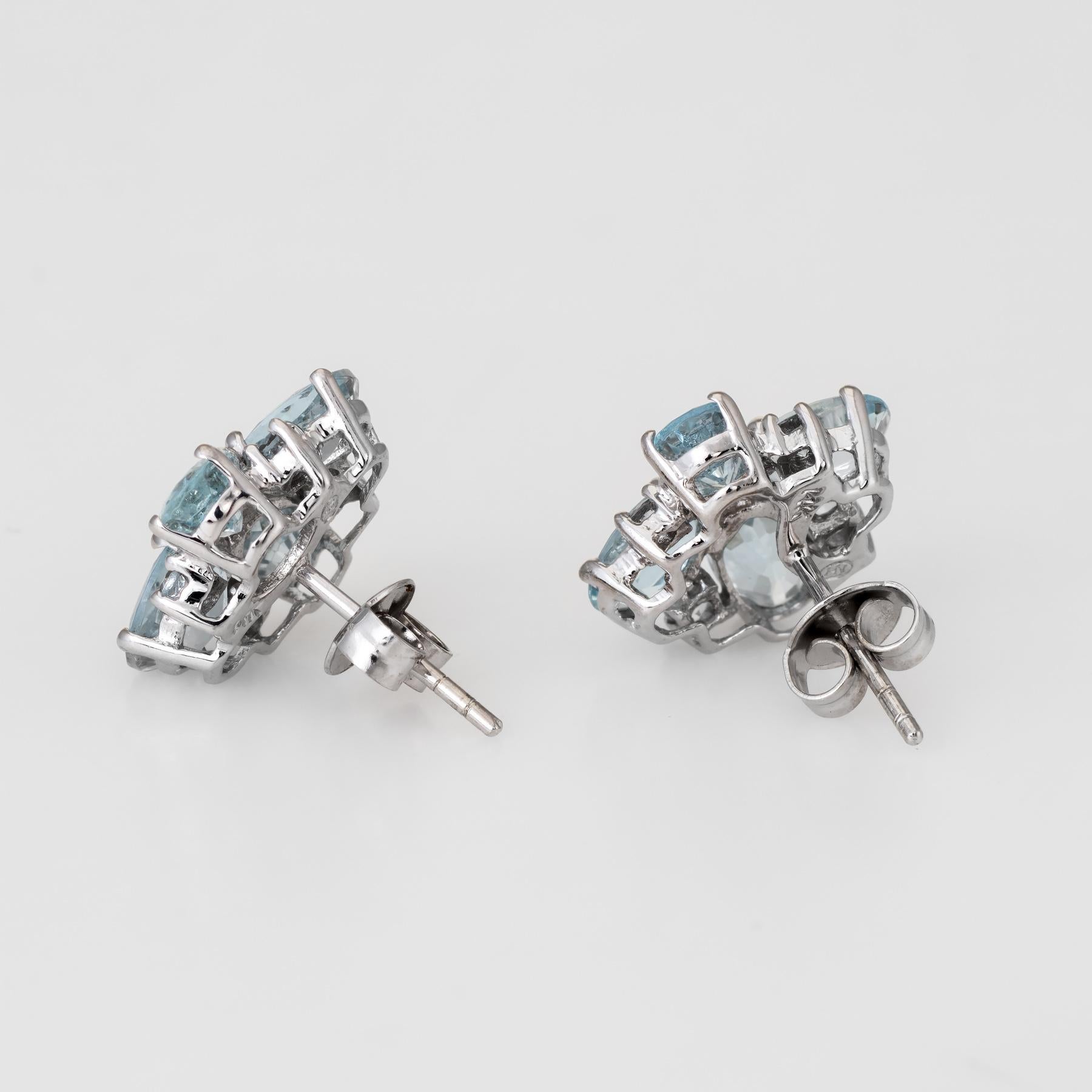 Elegant pair of aquamarine square stud earrings, crafted in 14k white gold. 

Faceted oval and round cut aquamarines total an estimated 2 carats. The aquamarines are in excellent condition and free of cracks or chips.  

The earrings feature post