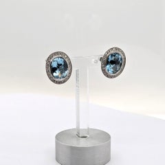 Aquamarine Stud Earrings with a Diamond Halo in 14k White Gold
