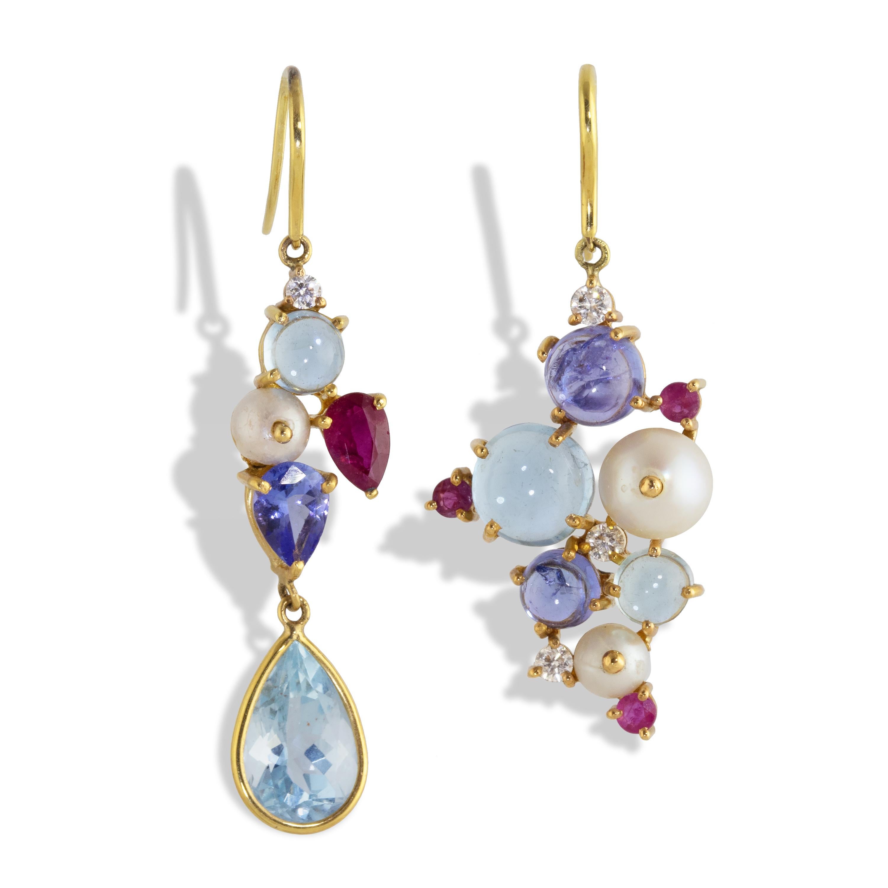 Mismatched pair of cluster earrings featuring Aquamarine, Tanzanite, Diamonds, Rubies and Pearls compliment each other in slightly different shapes.  A 3.84  carat Aquamarine pear drop hangs from a cluster which includes a pear shaped tanzanite,