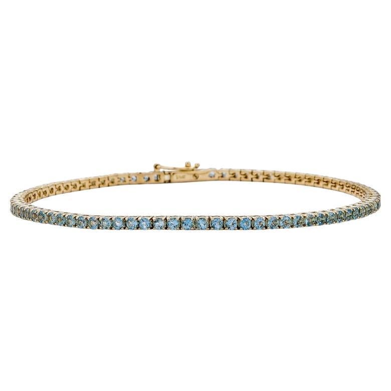 Bracelet tennis en aigue-marine et or jaune 14 carats - 16,51 cm