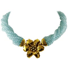 Aquamarine Torchon with 18 Karat Yellow Gold and Diamonds Flower Closure