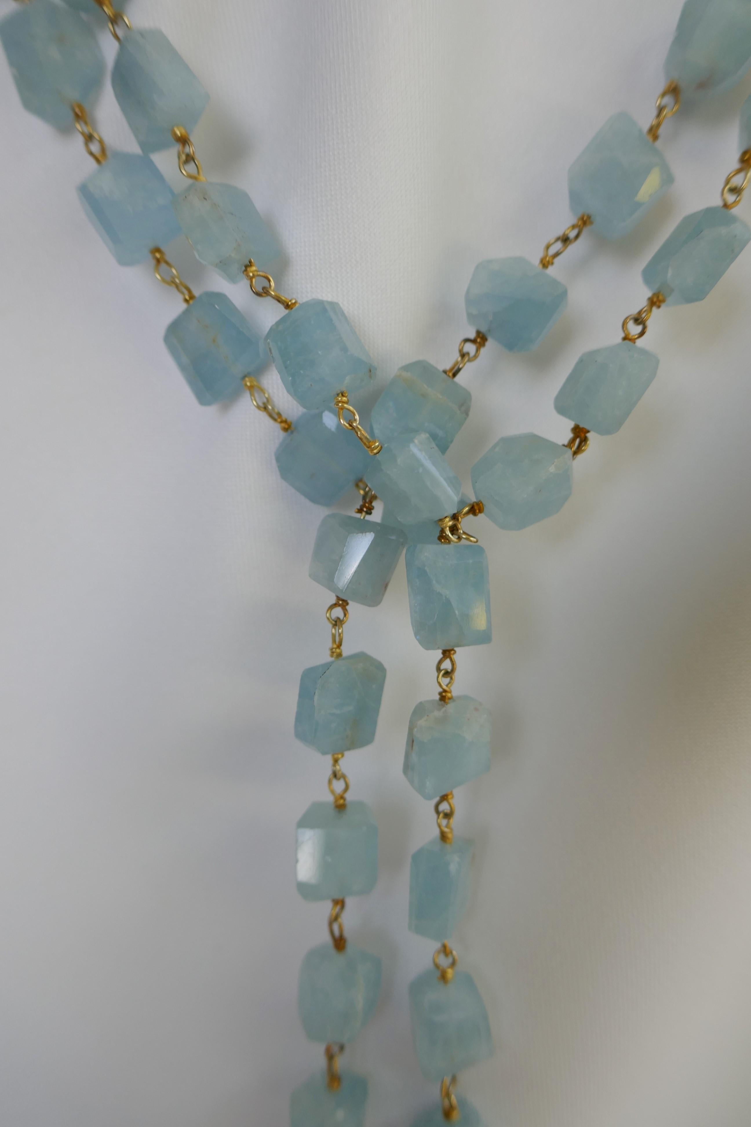 This lariat necklace is made of aquamarine stone nuggets which have a beautiful aquamarine color and are wired wrapped in vermeil 925 silver.  The necklace is finished with white baroque cultured pearls that have beautiful luster. The necklace may