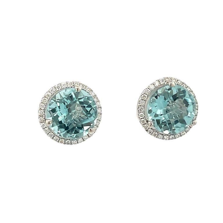 This pair of earrings are made of two round aquamarine color stones with a total weight of 4.36 carats selected for their color and brilliance. These beautiful aquamarine earrings are made also with a single row of round white diamonds with a total