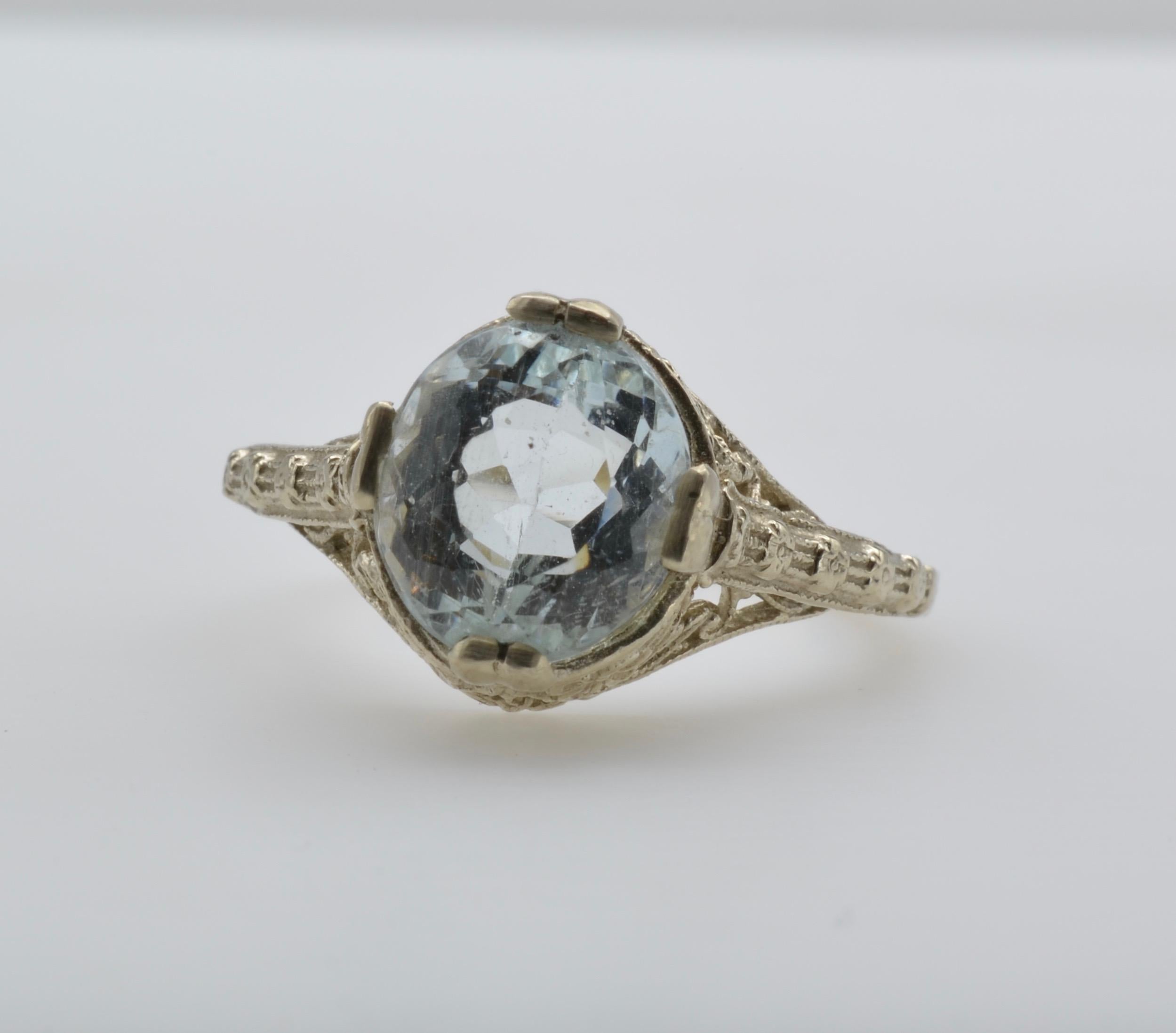 This lovely aquamarine ring is beautifully set in a engraved setting of 14k white gold. The dreamy blue aquamarine is beautifully cut to cast a dazzle in every direction. This stunner would make a wonderful engagement ring for the diamond