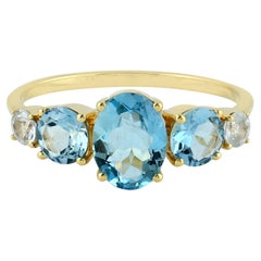Anillo de Aguamarina y Zafiro Blanco de Oro Amarillo de 18 K