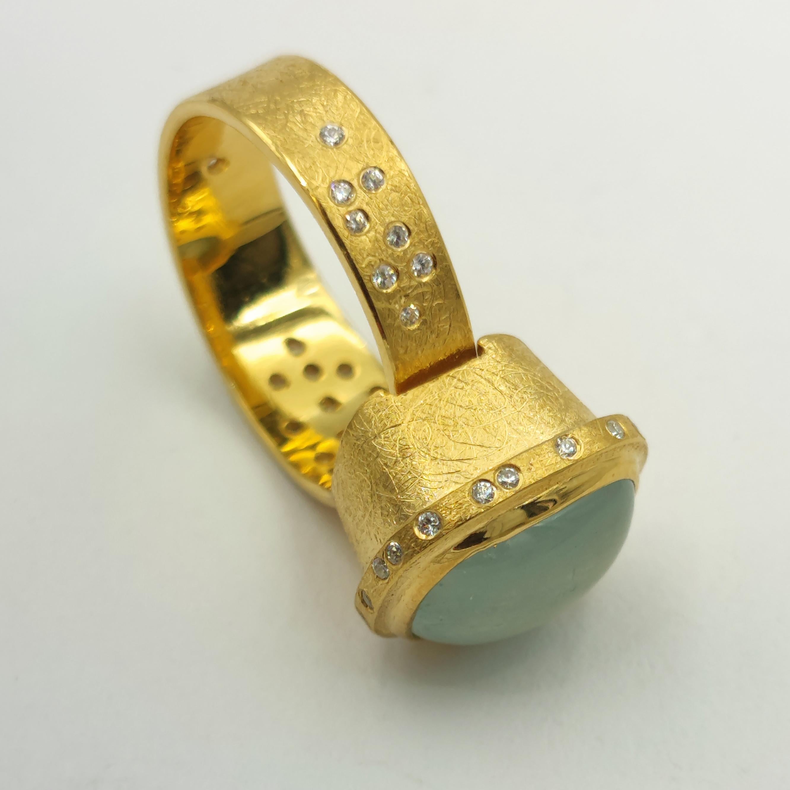 Aquamarine White Zircon Silver 24 K Gold Plate Contemporary  Design Modern Ring
Hand made unique adjustable ring with aquamarine and cubic zirconia.
Natural aquamarine in the form of a cabochon, inlaid with cubic zirconia (46 stones with a diameter
