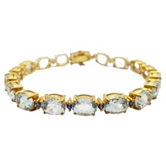 Pulsera de aguamarina y zafiro azul engastada en oro de 18 quilates