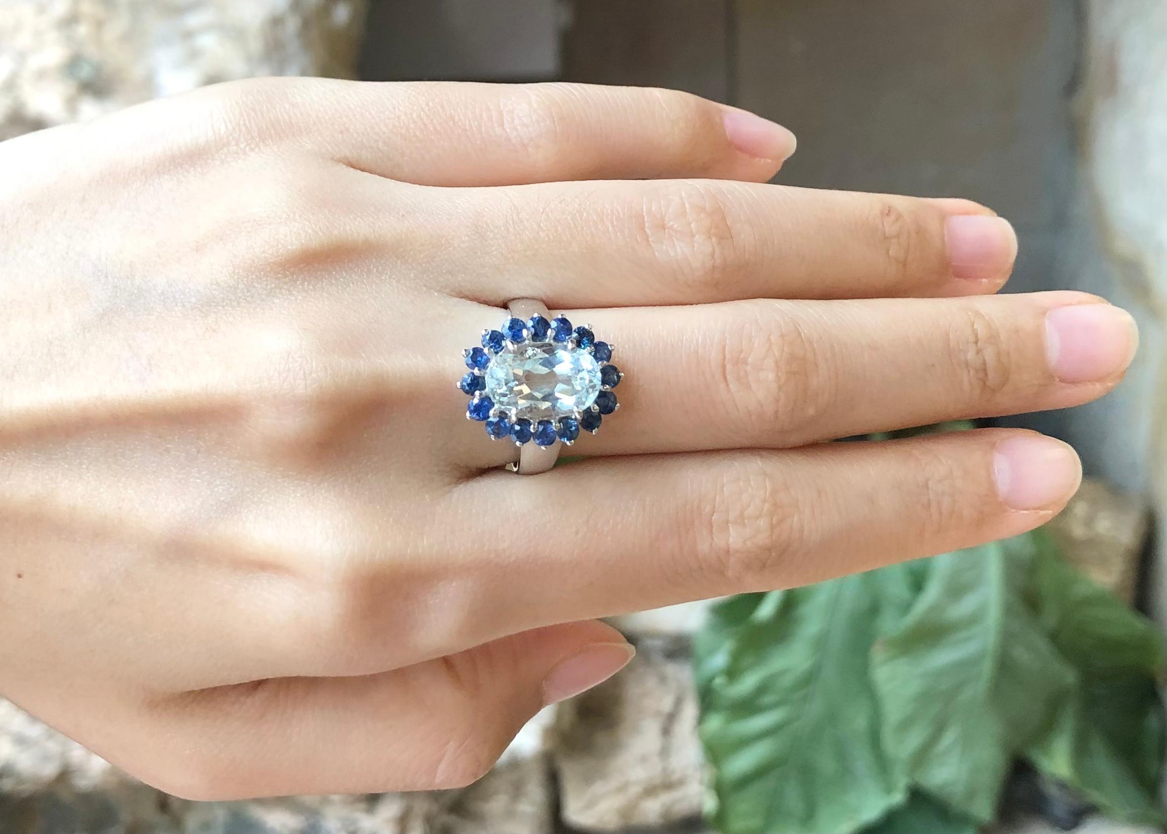 Aquamarine with Blue Sapphire Ring set in Silver Settings

Width:  1.3 cm 
Length: 1.8 cm
Ring Size: 57
Total Weight: 4.21 grams

*Please note that the silver setting is plated with rhodium to promote shine and help prevent oxidation.  However, with