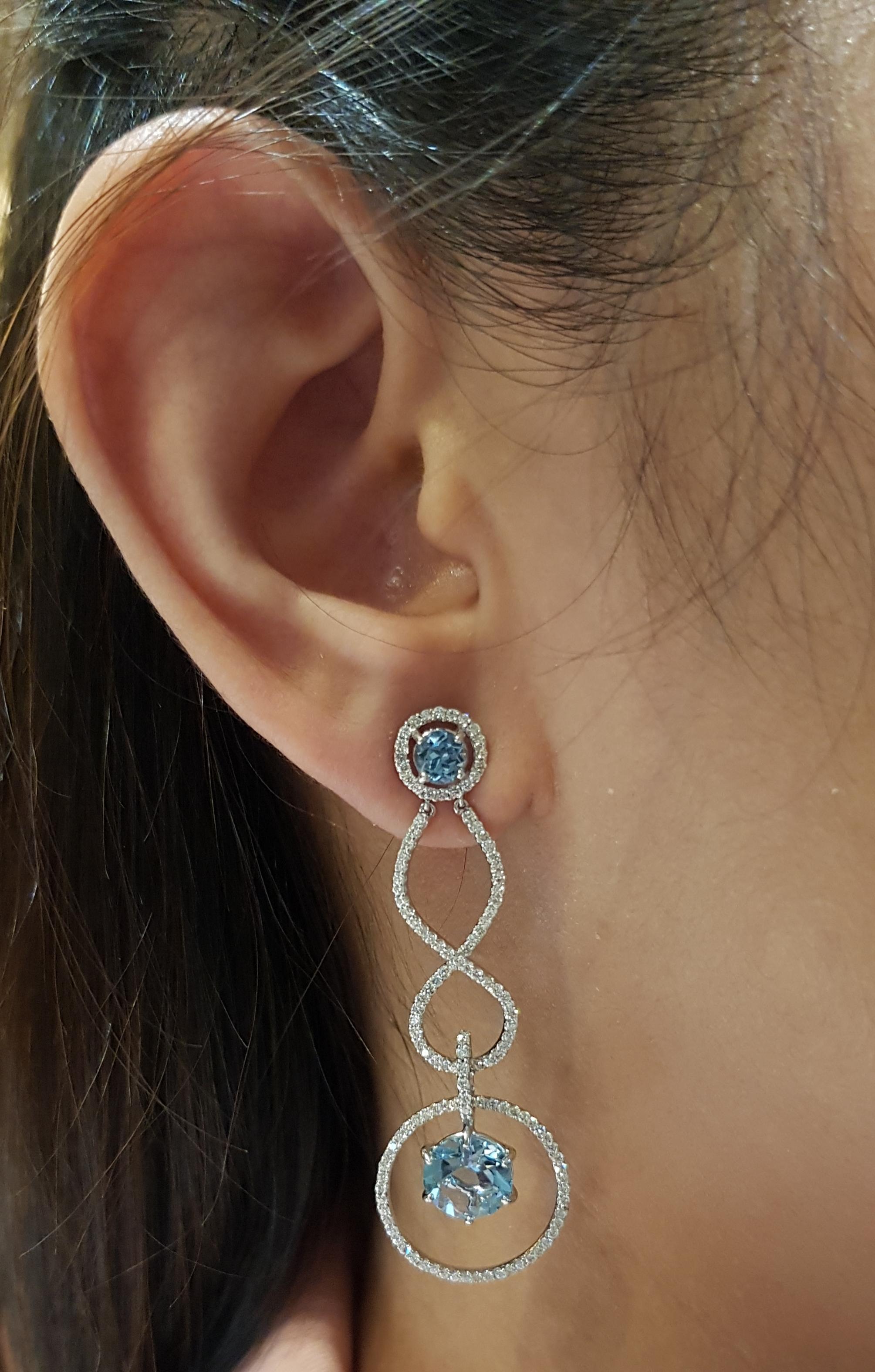 Aquamarine 3.82 carats with Diamond 1.17 carats Earrings set in 18 Karat White Gold Settings

Width:  1.7 cm 
Length:  5.0 cm
Total Weight: 8.74 grams

