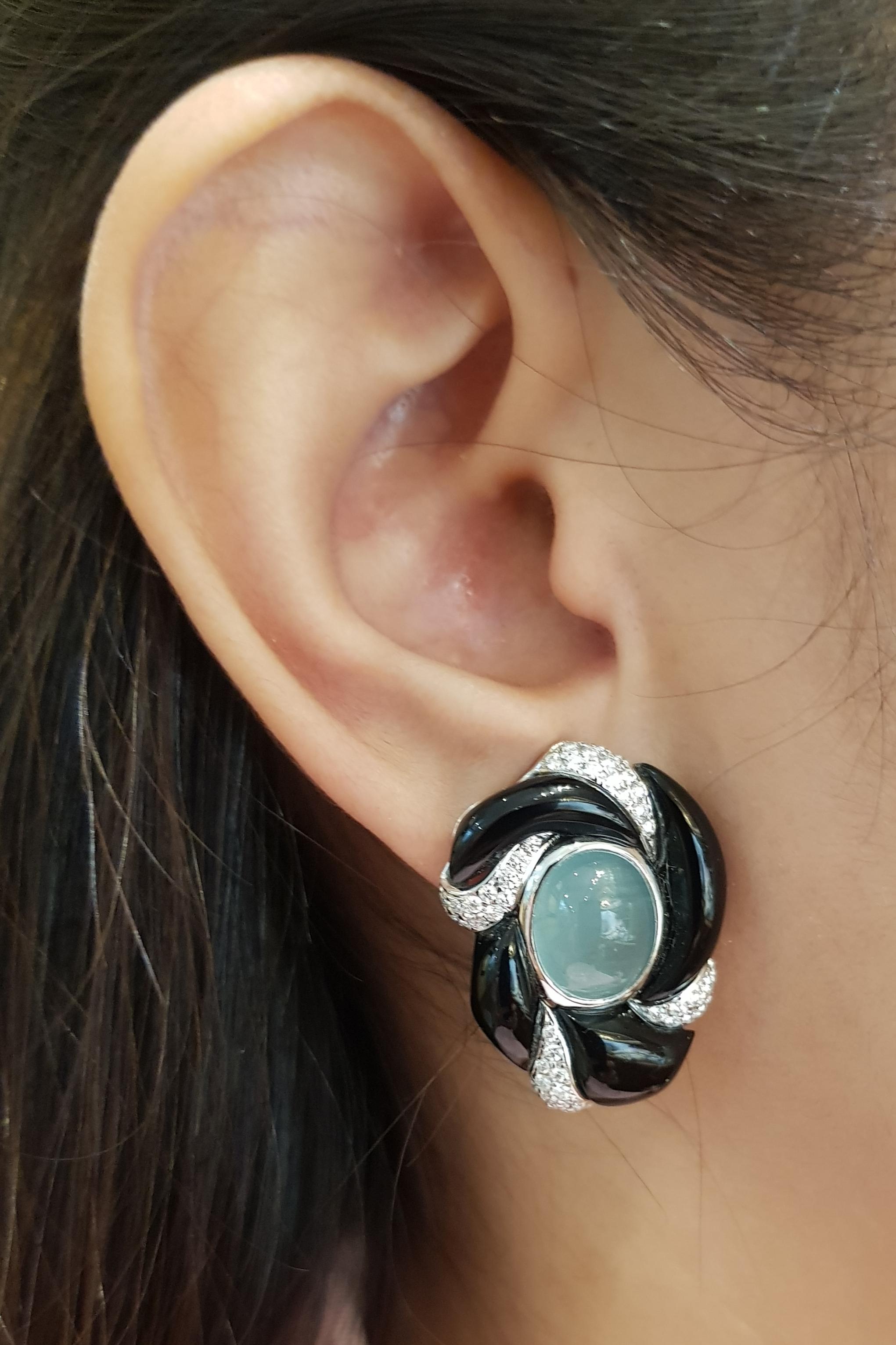 Cabochon Aquamarine 13.50 carats with Diamond 0.89 carat Earrings set in 18 Karat White Gold Settings

Width:  2.2 cm 
Length:  3.9 cm
Total Weight: 20.11 grams

