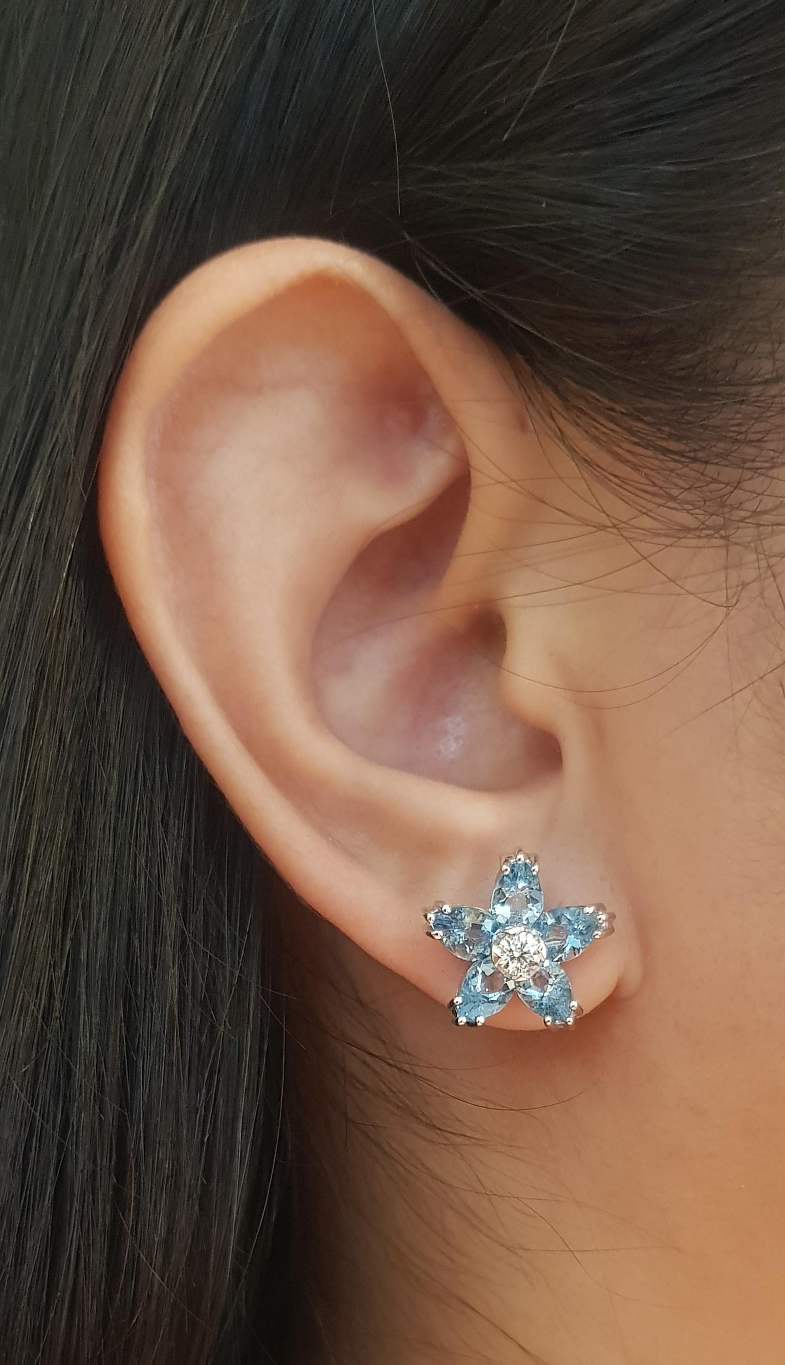 Aquamarine 3.57 carats with Diamond 0.30 carat Earrings set in 18K White Gold Settings

Width: 1.5 cm 
Length: 1.5 cm
Total Weight: 5.39 grams

